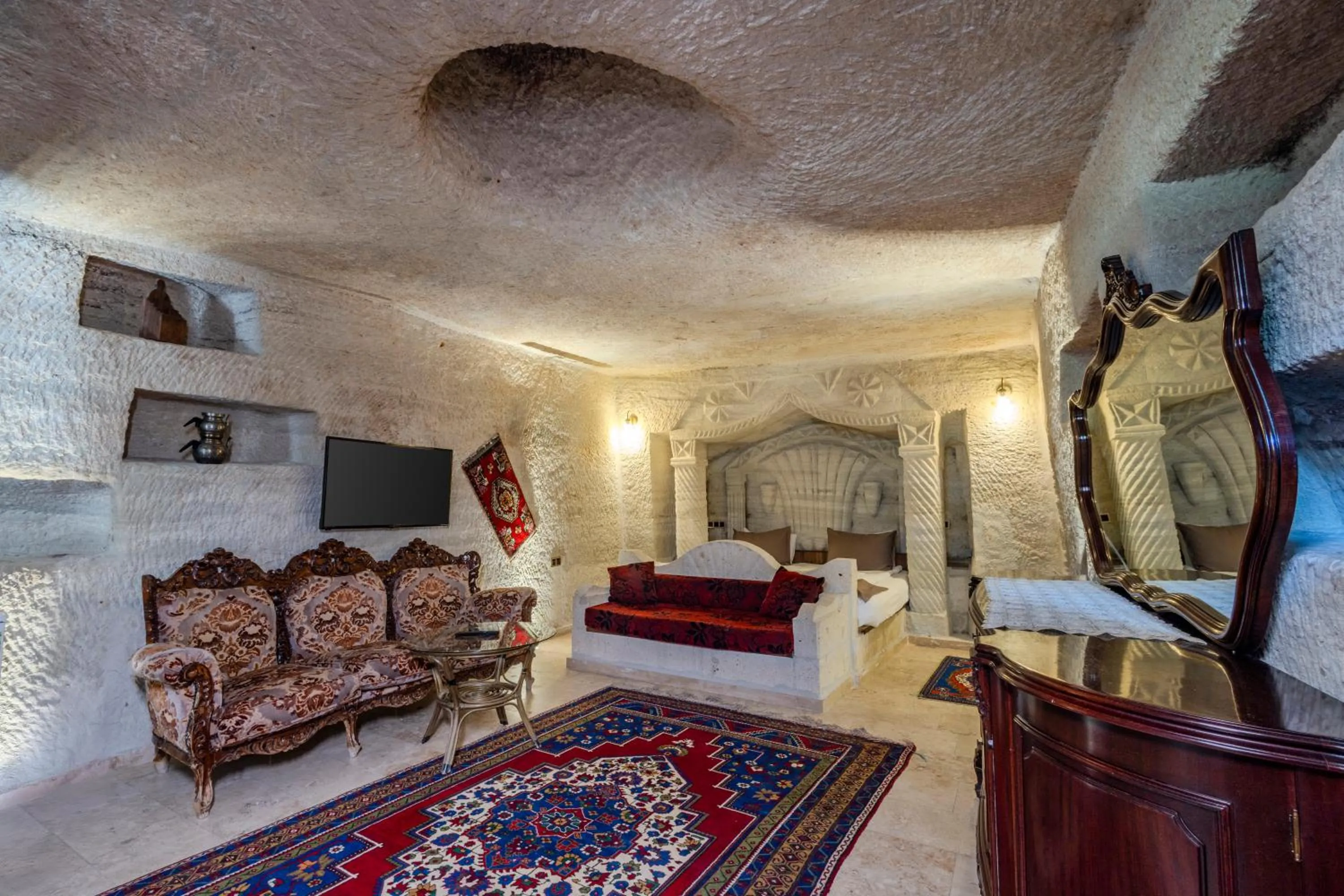 Bed in Kayatas Cave Suites