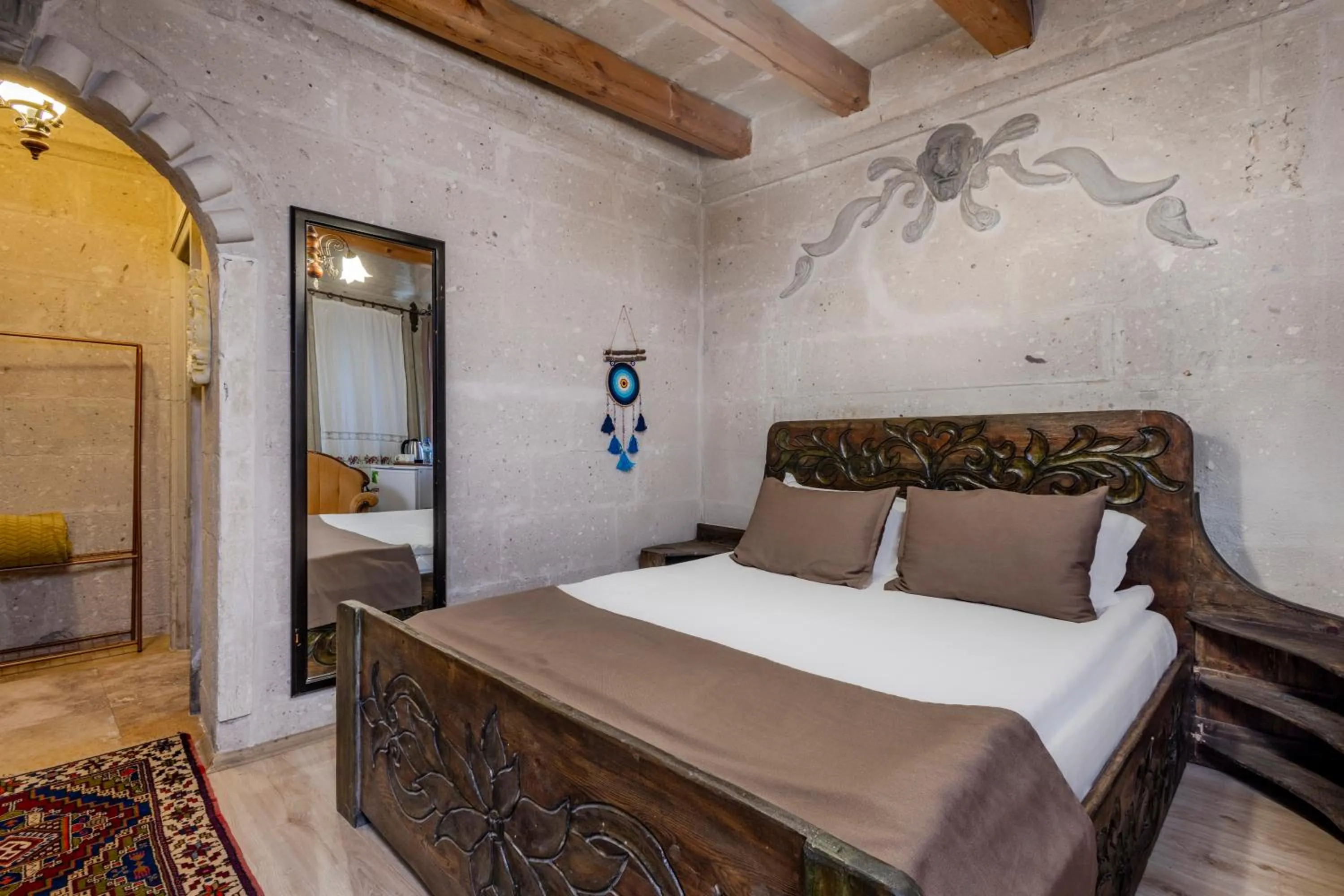 Bed in Kayatas Cave Suites