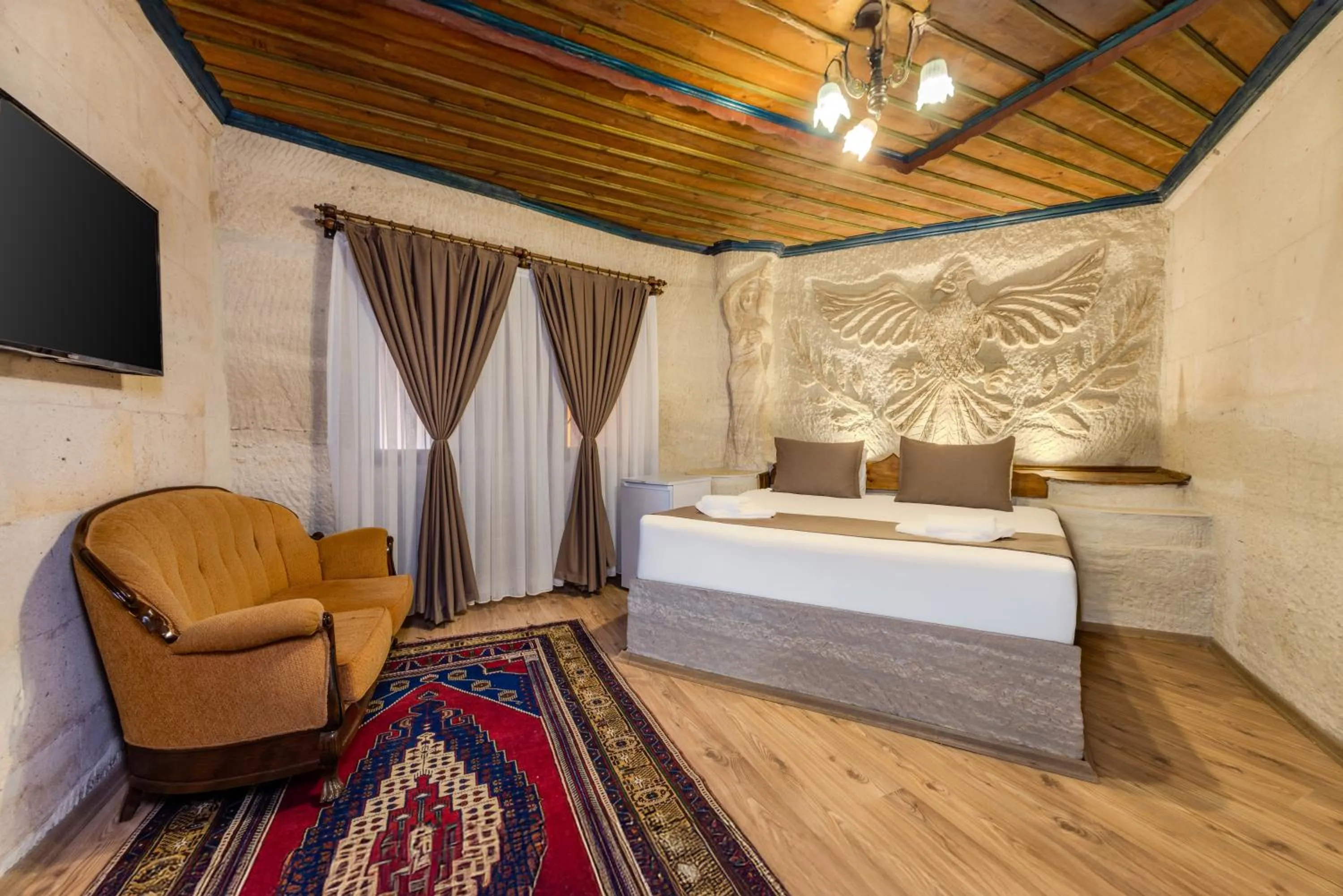 Bed in Kayatas Cave Suites