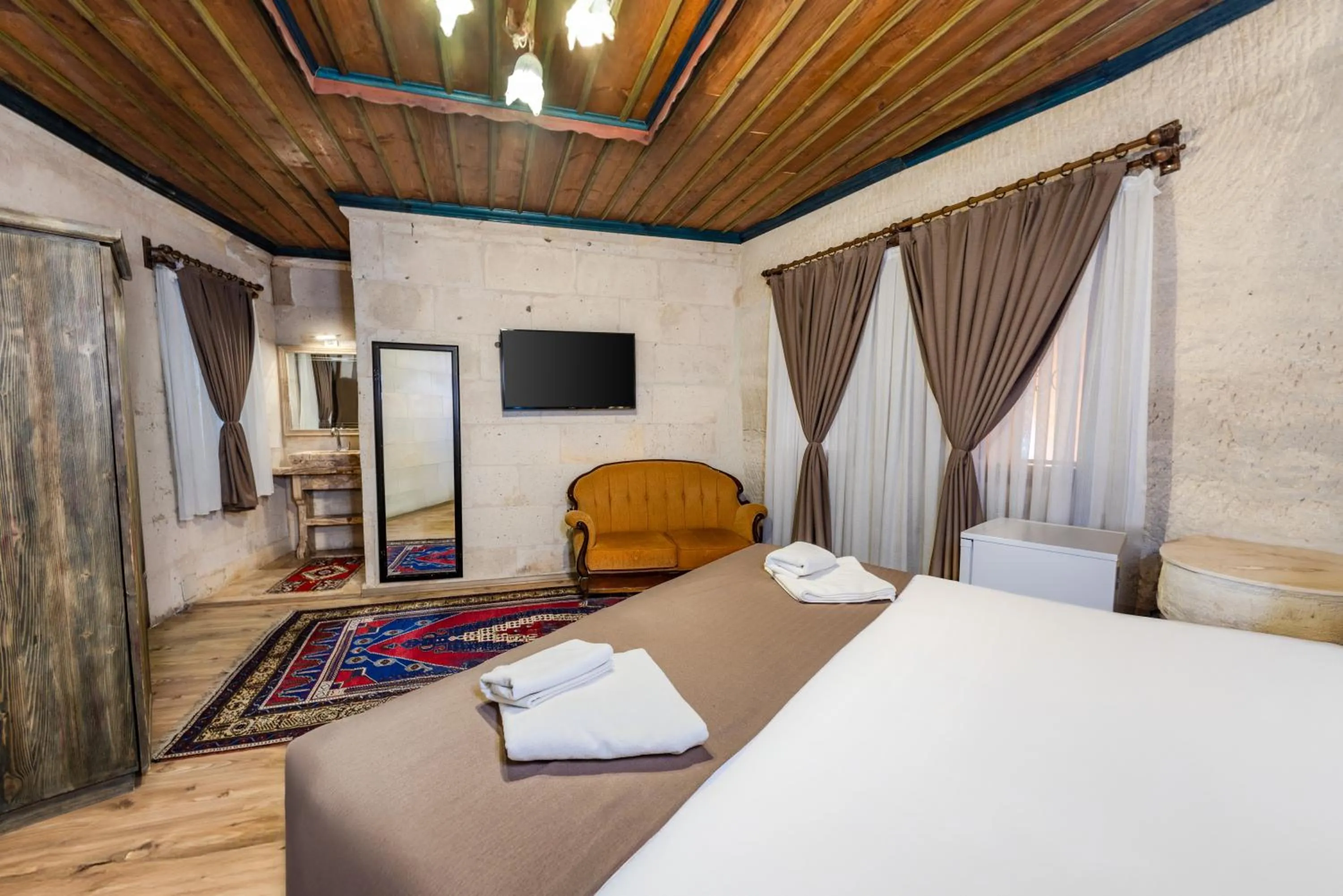 Bed in Kayatas Cave Suites