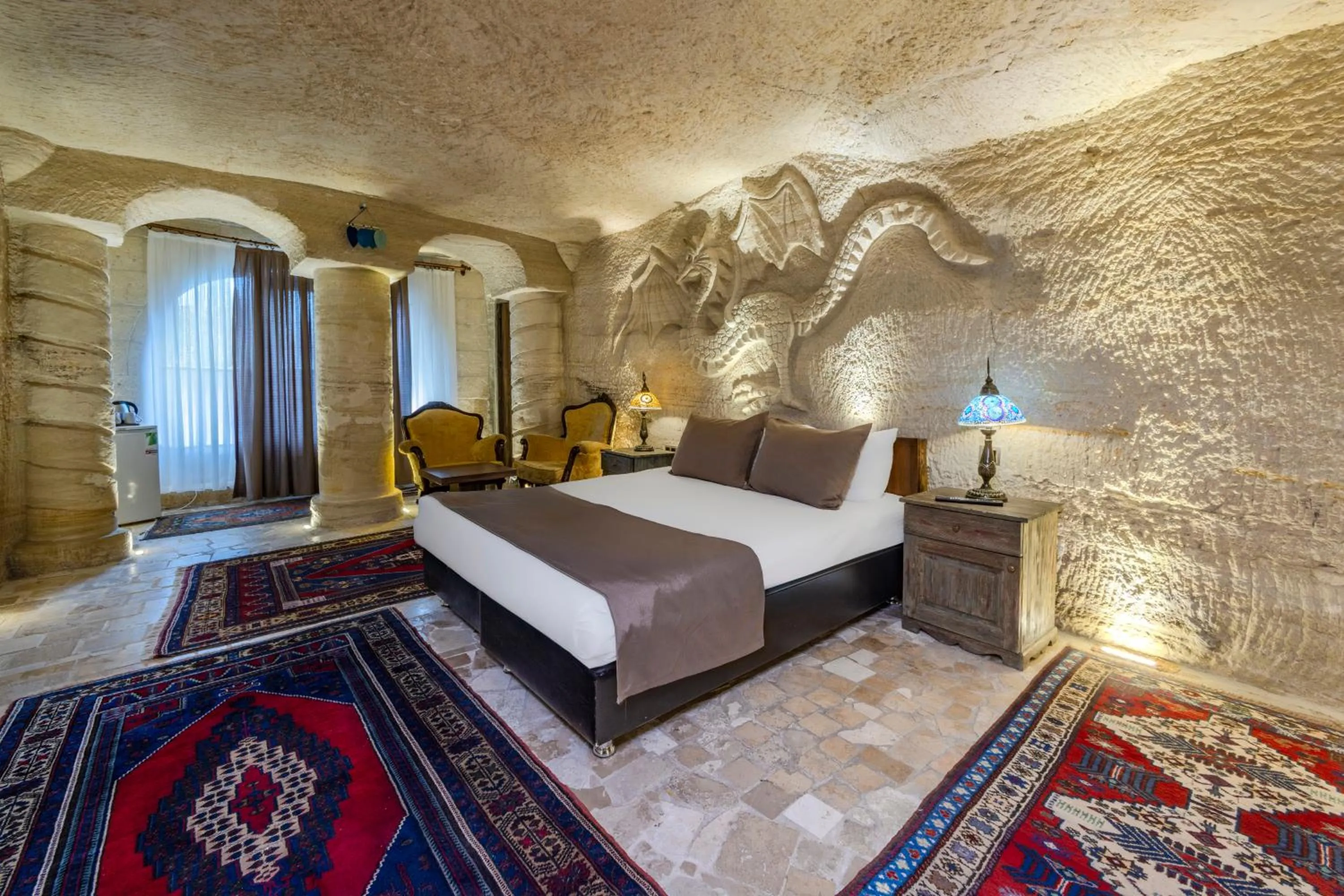 Bed in Kayatas Cave Suites
