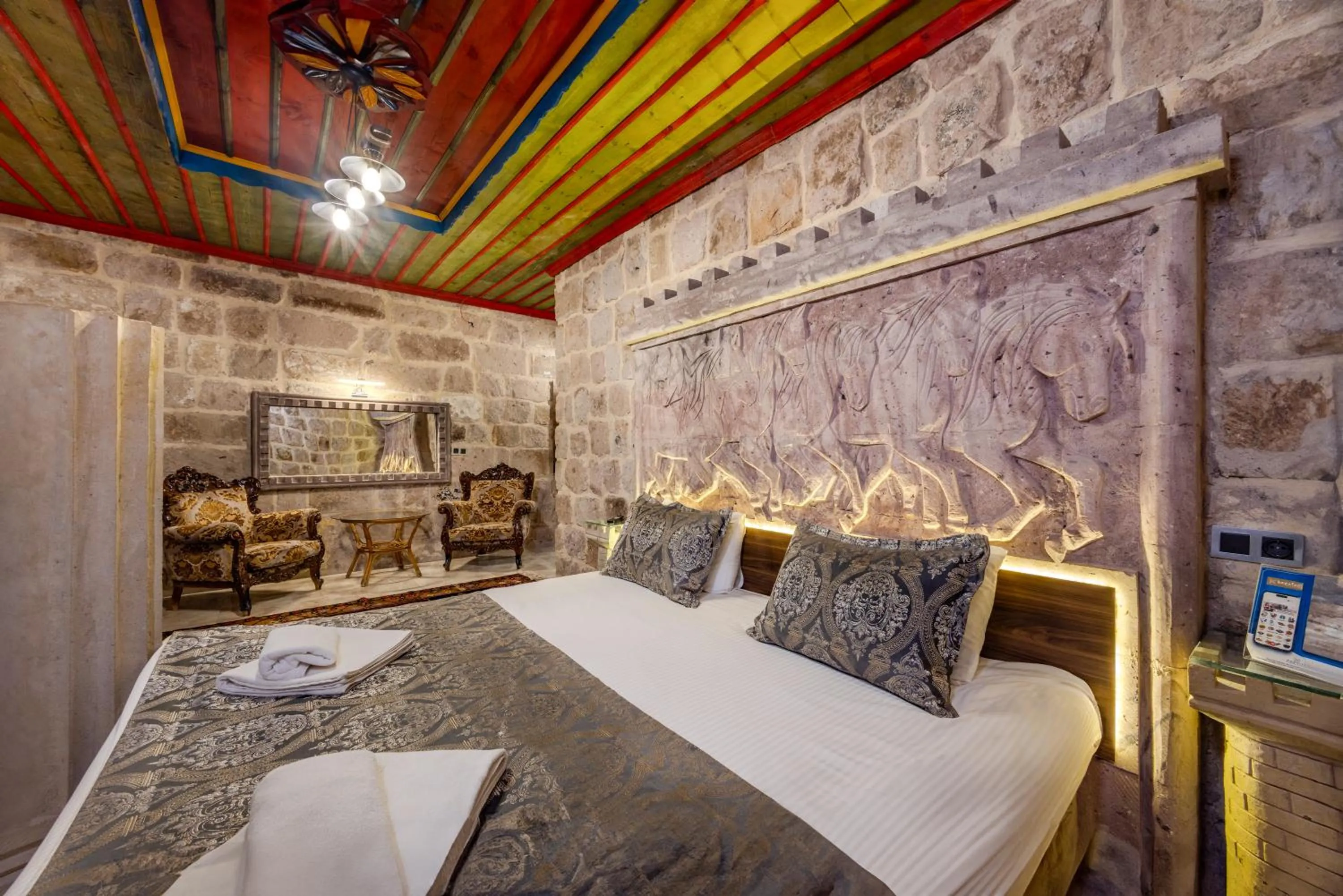 Bed in Kayatas Cave Suites