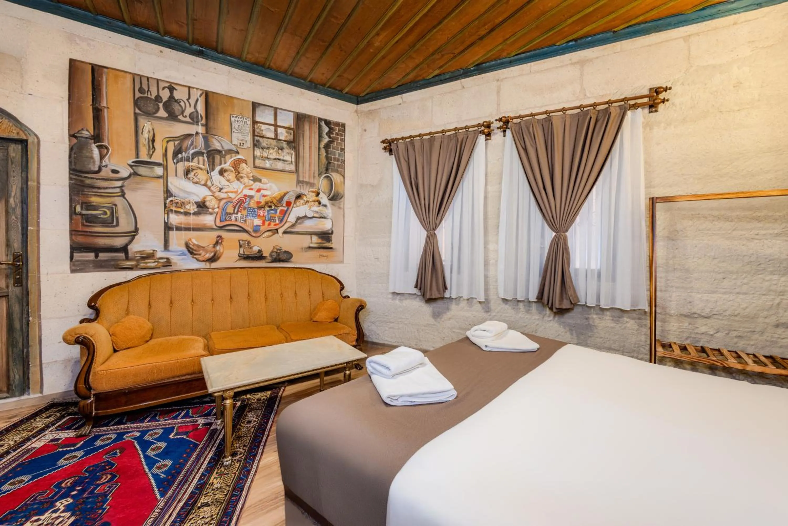 Bed in Kayatas Cave Suites