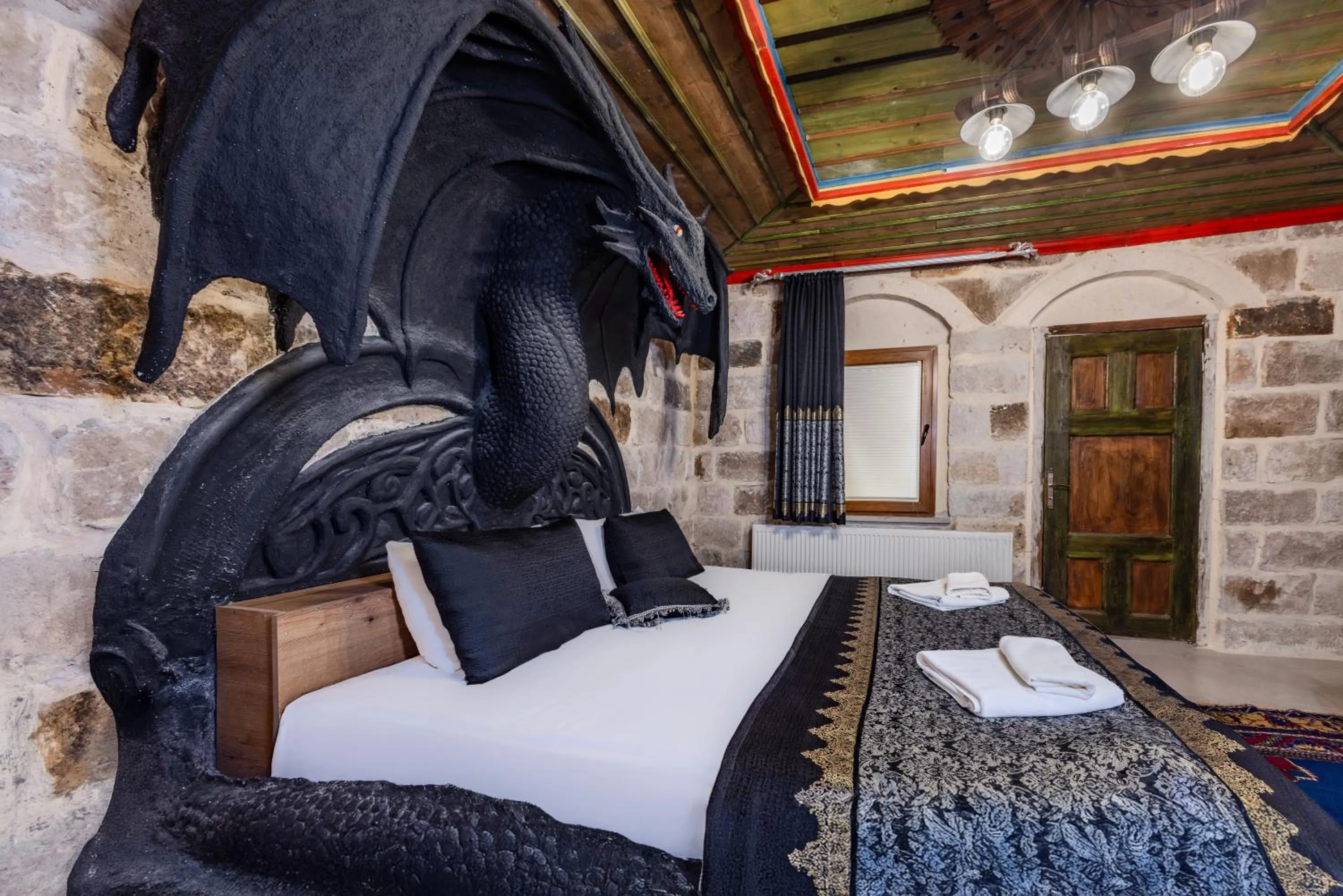 Bed in Kayatas Cave Suites