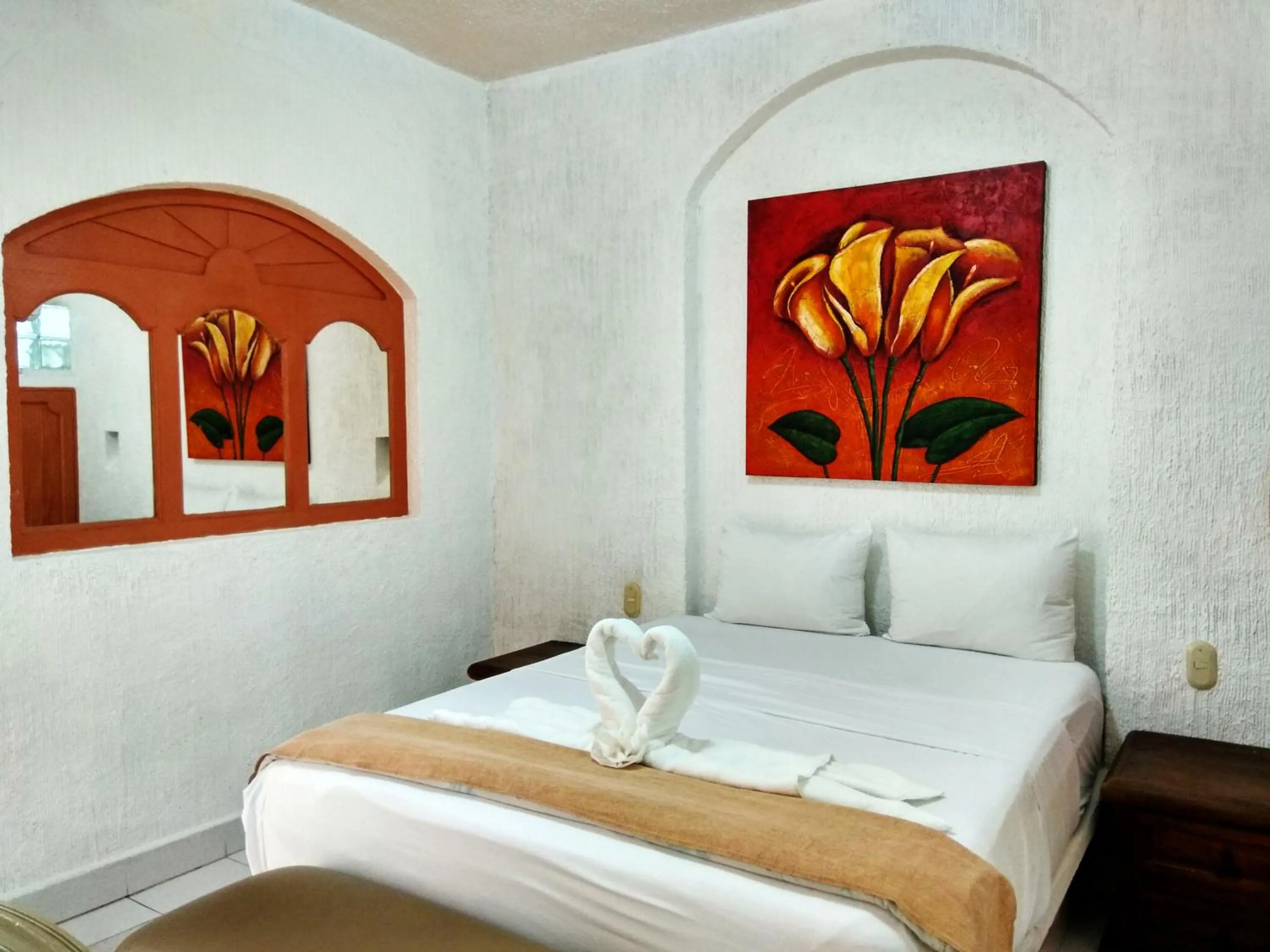 Bed in D'Cesar Hotel Acapulco