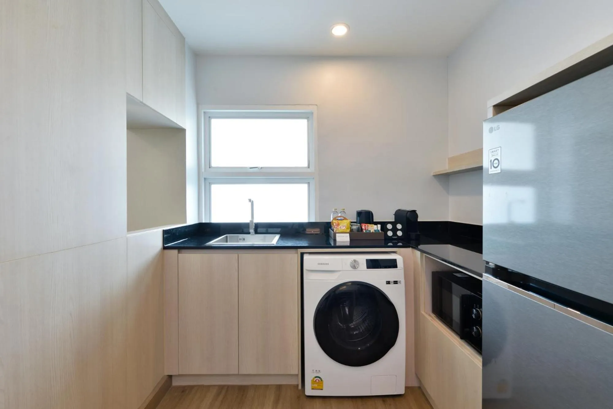 washing machine in Centre Point Plus Hotel Pratunam