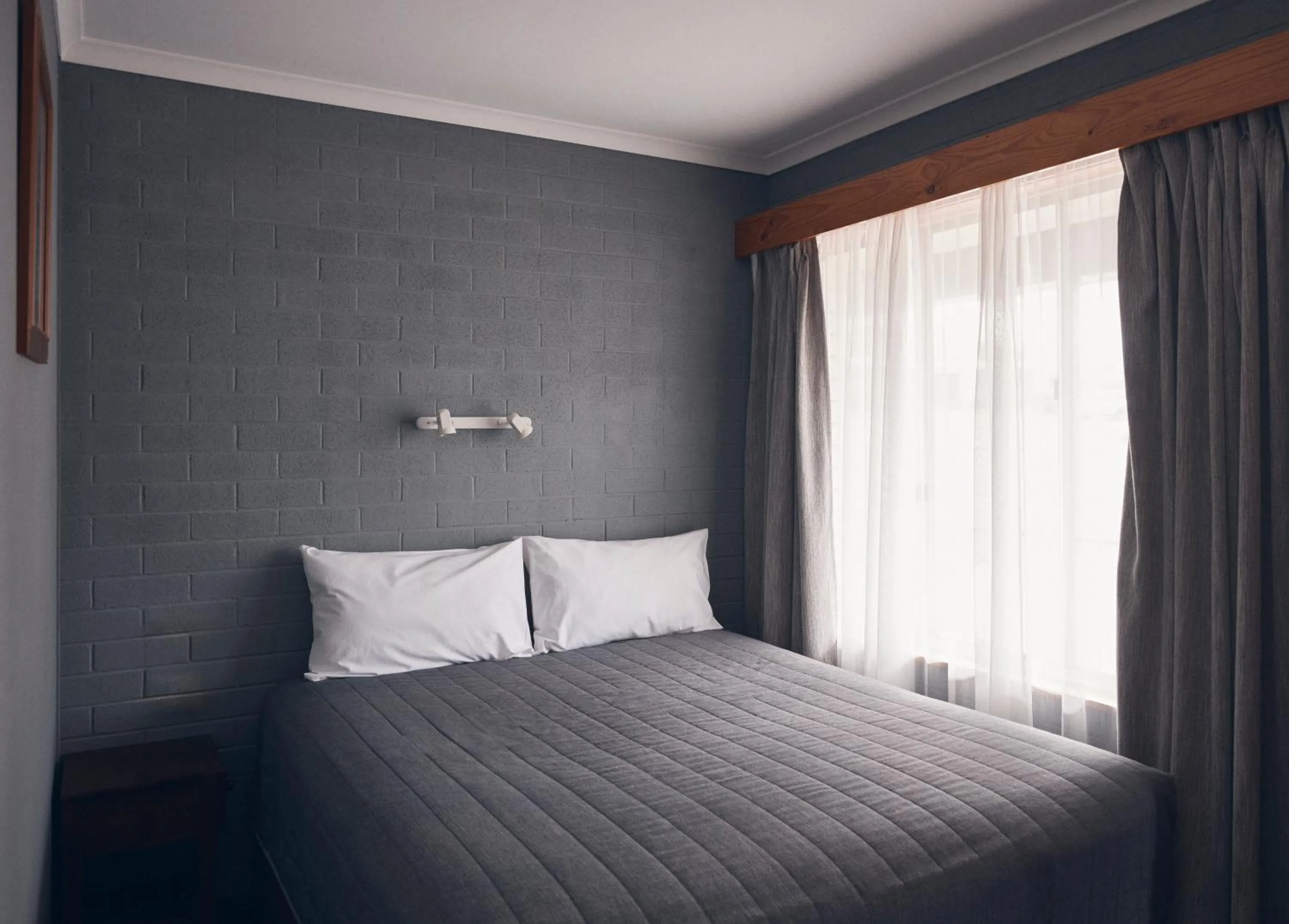 Bed in Coastal Comfort Motel