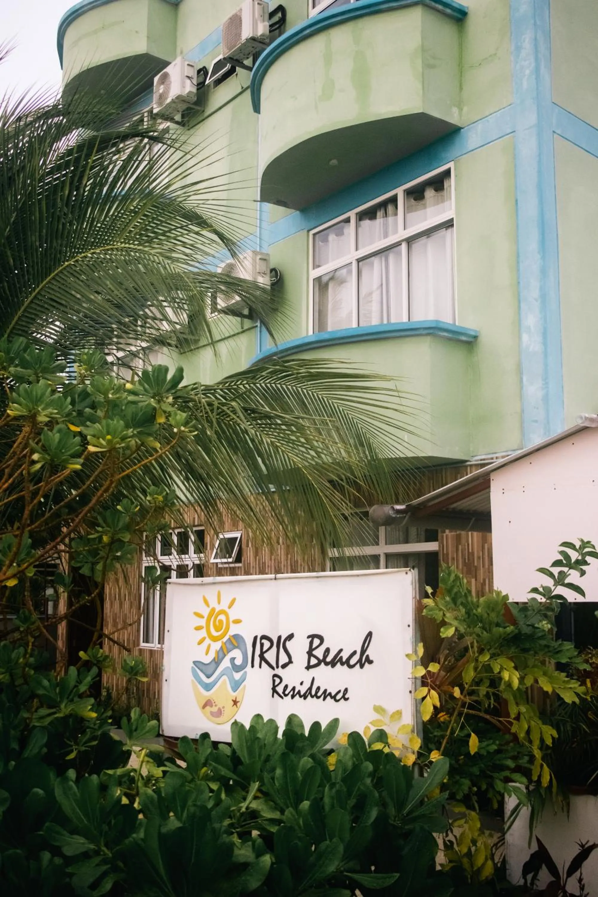 Property logo or sign in IRIS Beach Residence