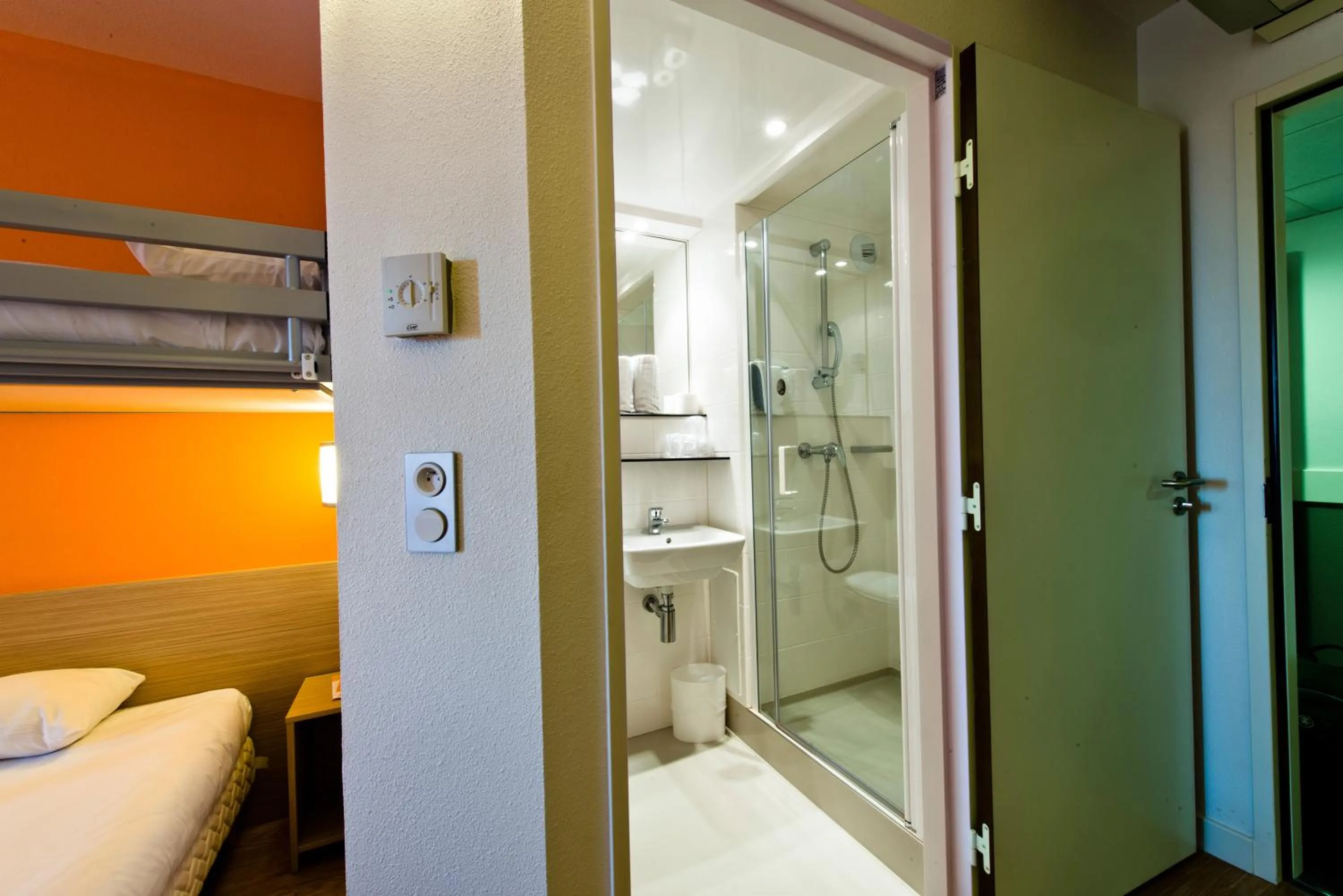 Bathroom, Bed in Premiere Classe Sens Nord- Saint Clément