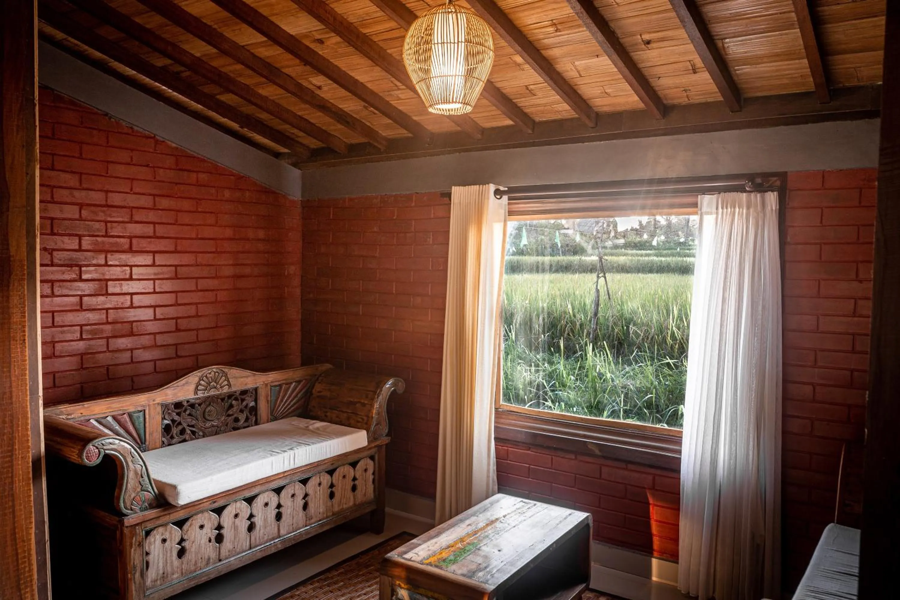 Seating area, Bed in Keramas Sacred River Retreat Resort and Villa