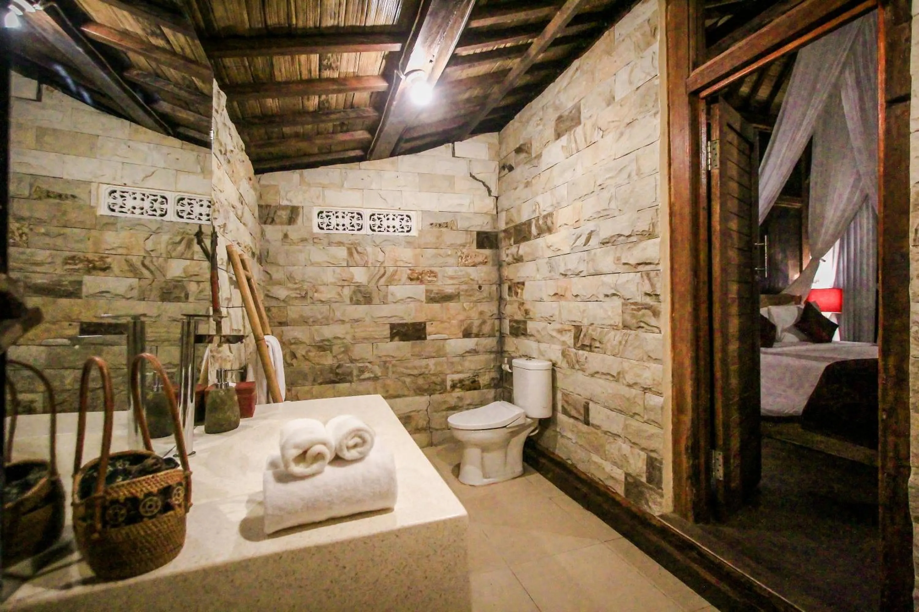 Bathroom, Bed in Keramas Sacred River Retreat Resort and Villa