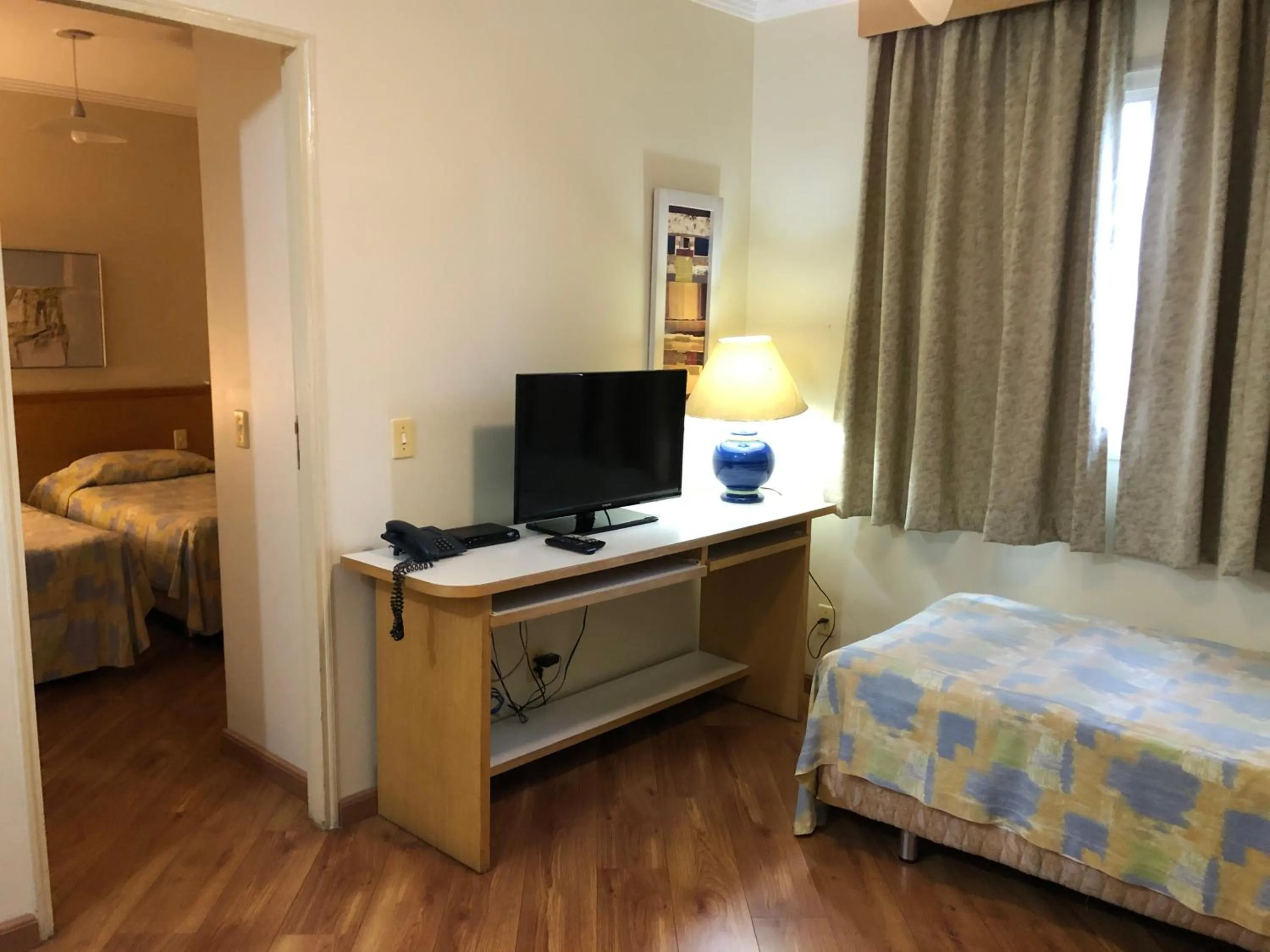 Communal lounge/ TV room, Bed in Residencial Bella Vista Suites