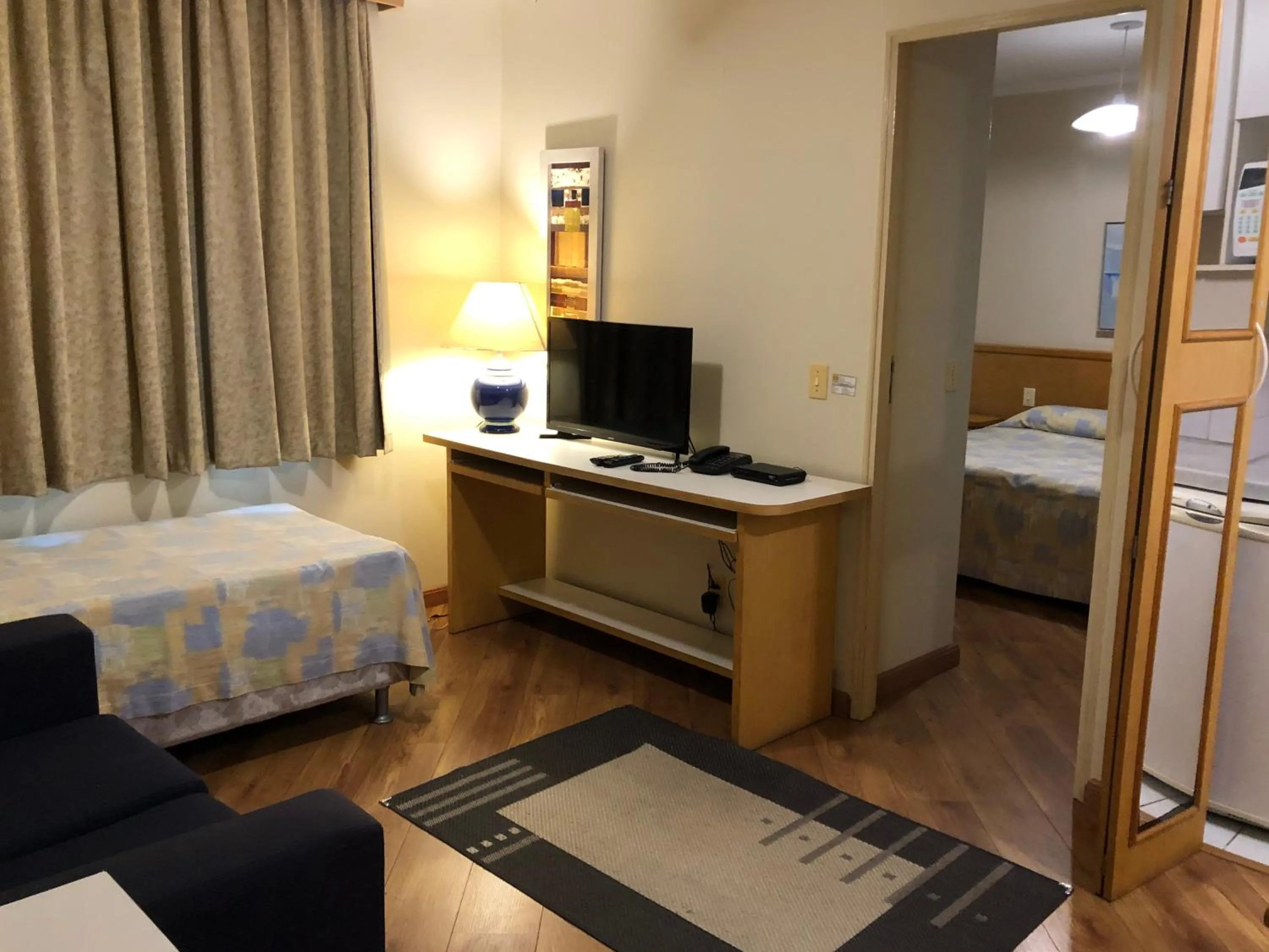 Communal lounge/ TV room, Bed in Residencial Bella Vista Suites