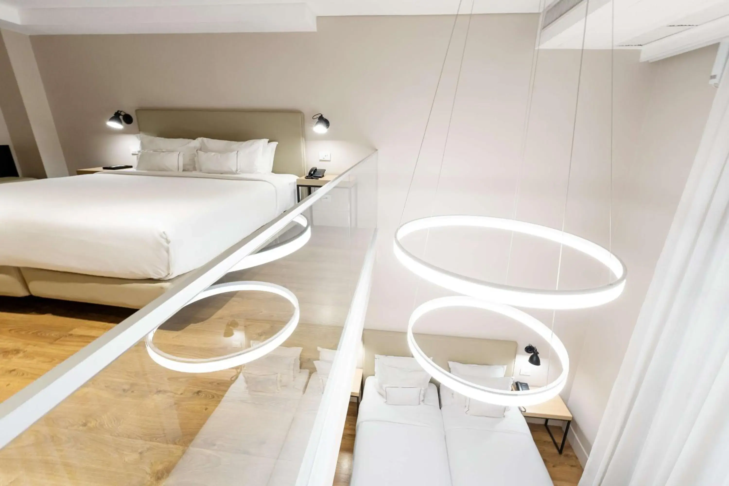 Duplex Family Room with One King Bed and Two Twin Beds in Palmaroga Hotel Asuncion, Tapestry Collection by Hilton Duplex Family Room with One King Bed and Two Twin Beds in Palmaroga Hotel Asuncion, Tapestry Collection by Hilton