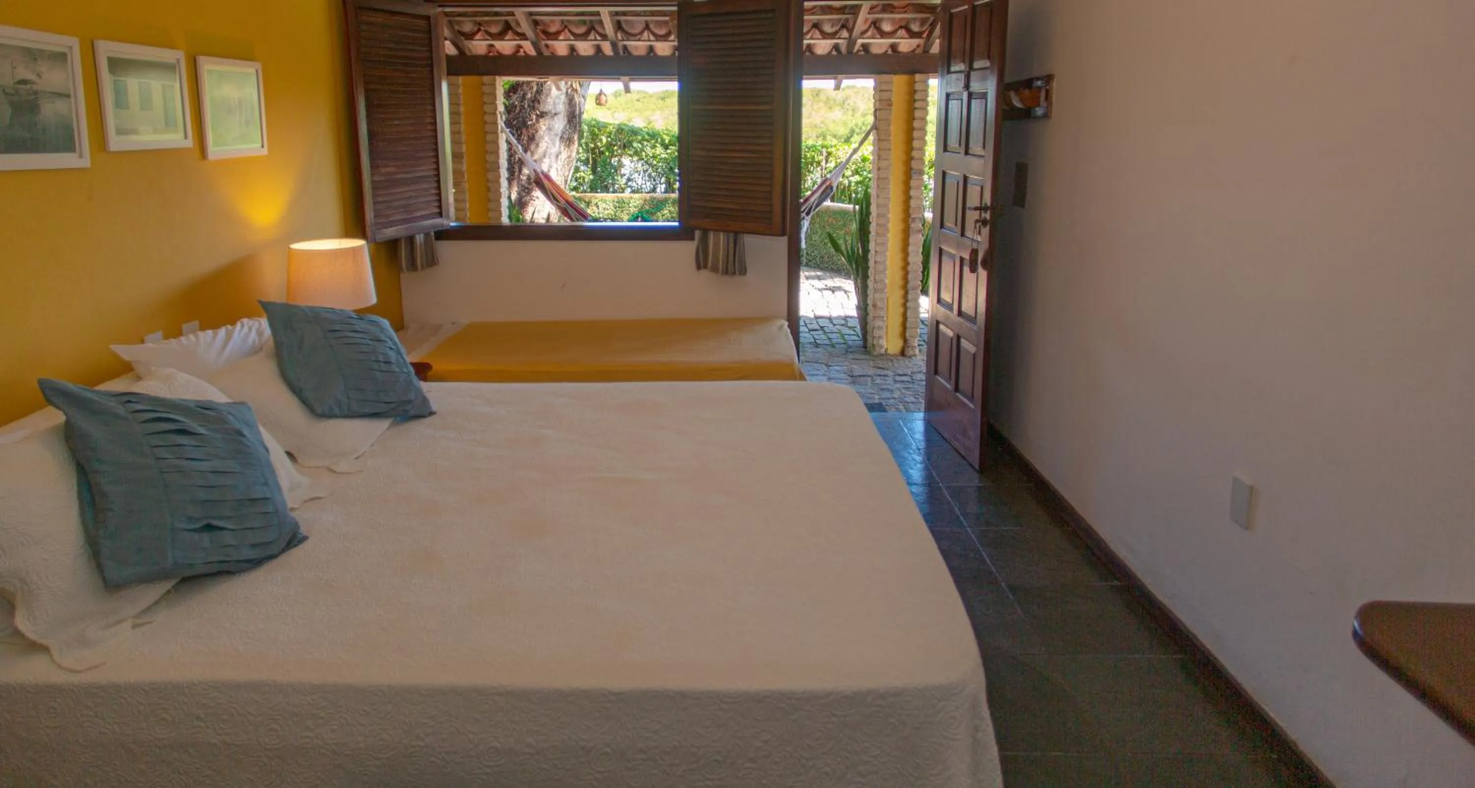 Bed in Pousada Canto do Rio