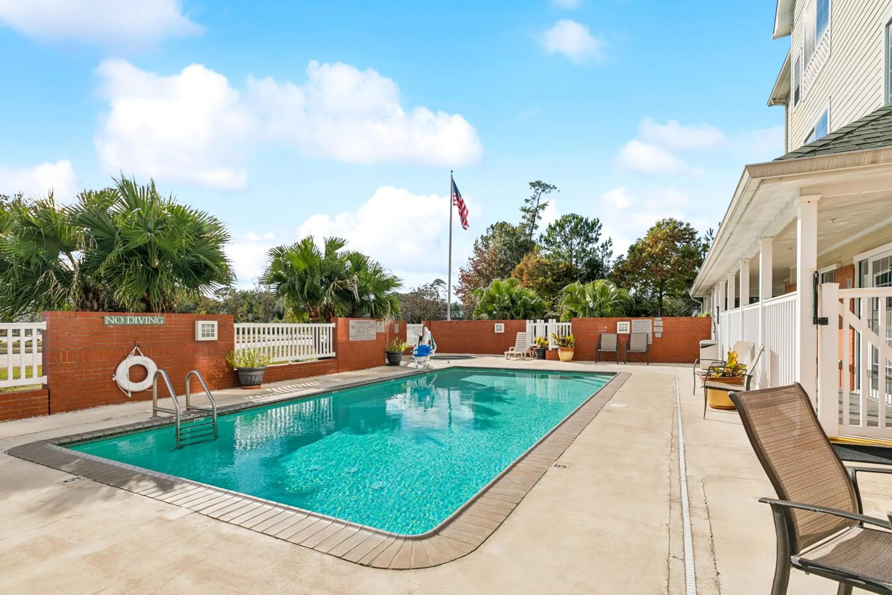 Pool view in Country Inn & Suites by Radisson, Covington, LA