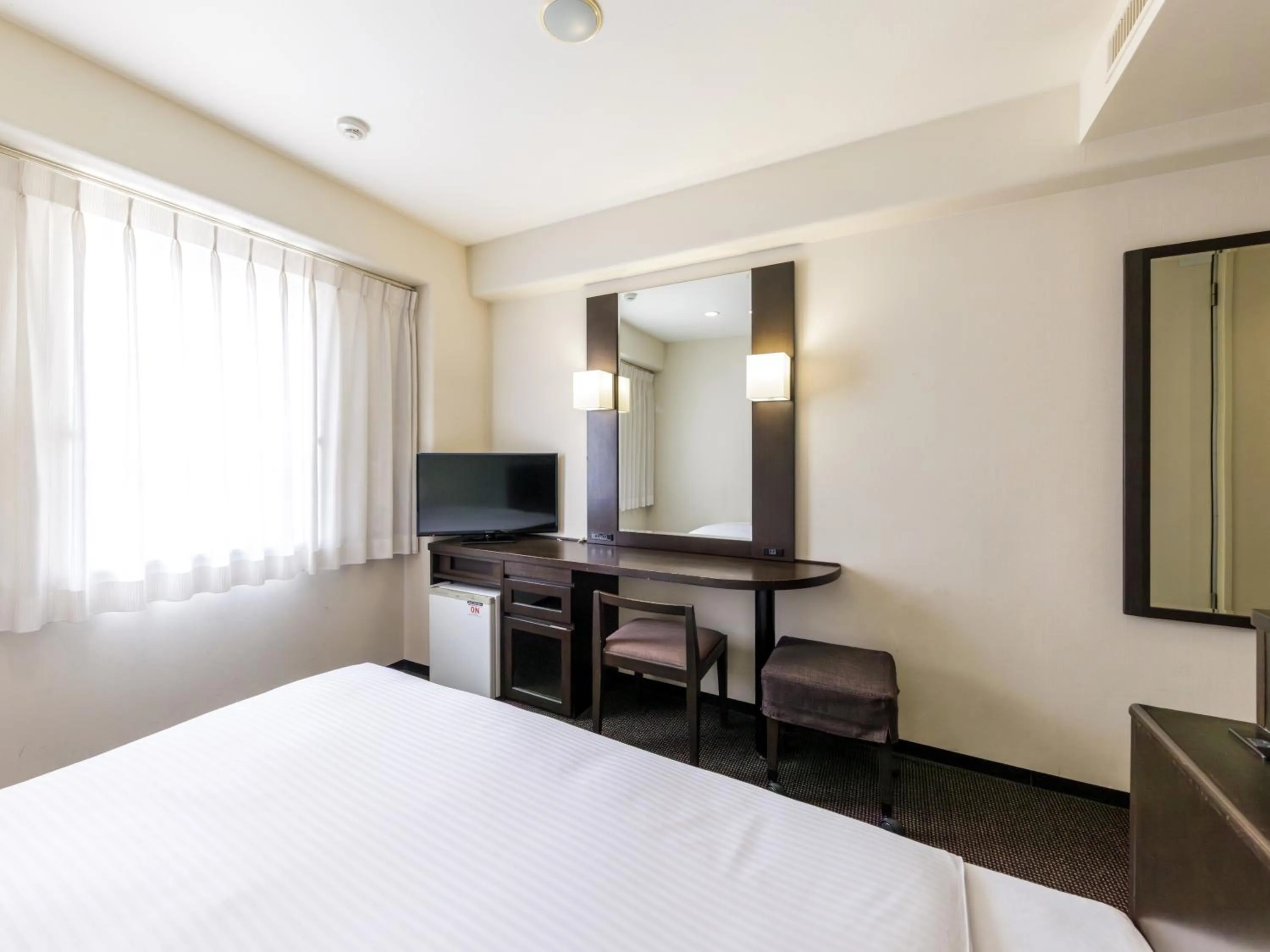 Photo of the whole room, Bed in Nishitetsu Inn Kokura