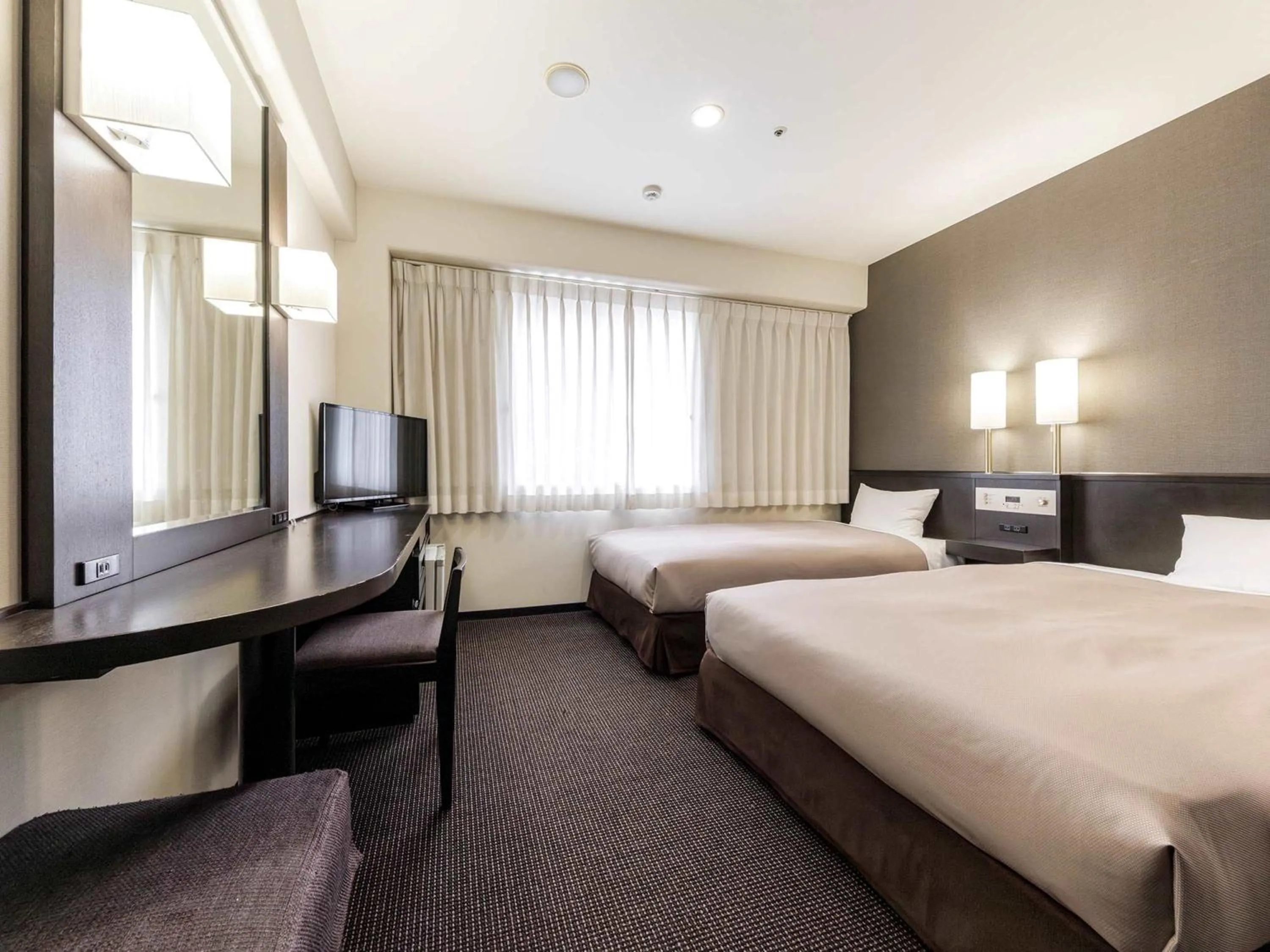 Bed in Nishitetsu Inn Kokura