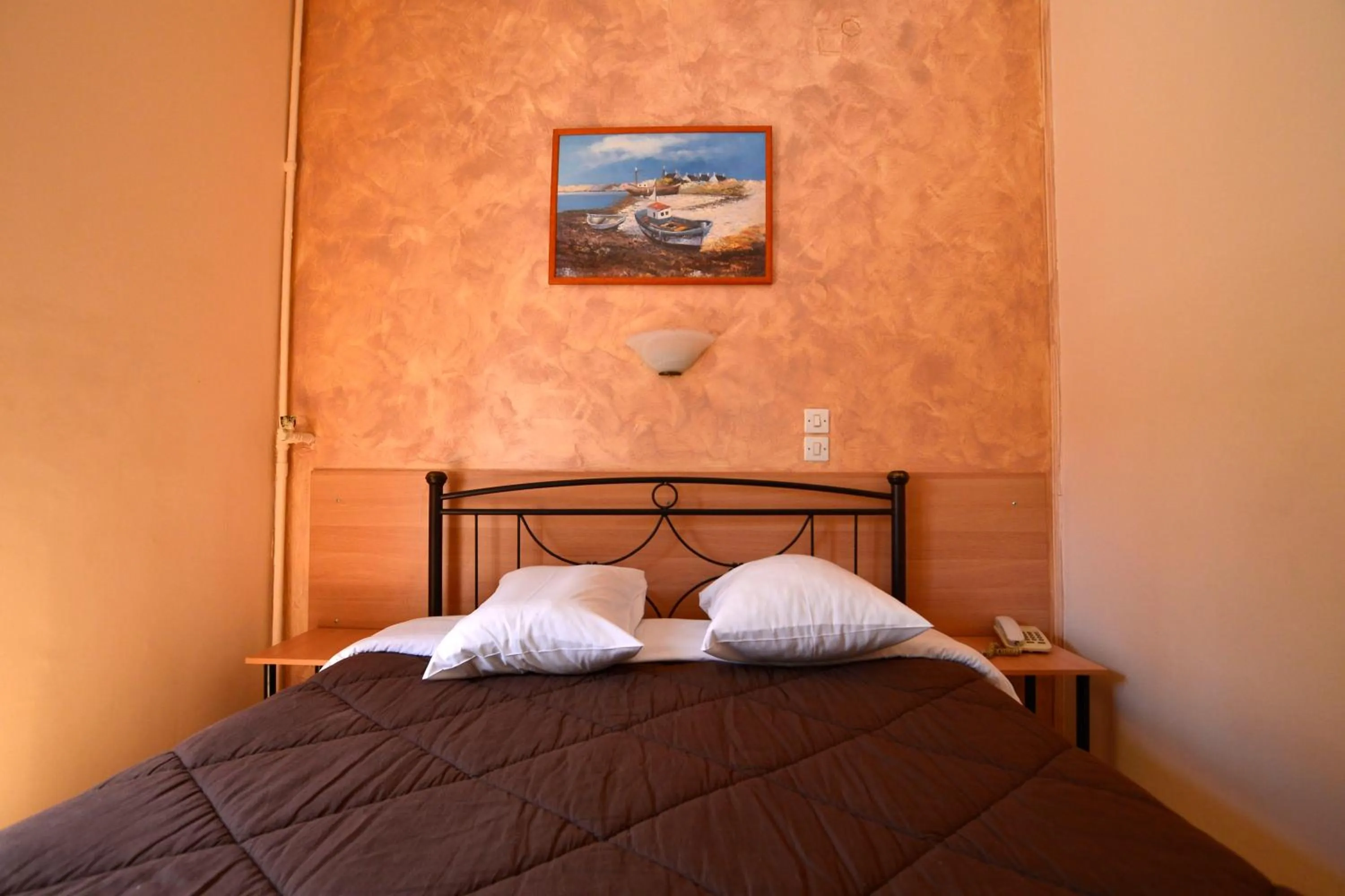 Bed in Electra Hotel Piraeus