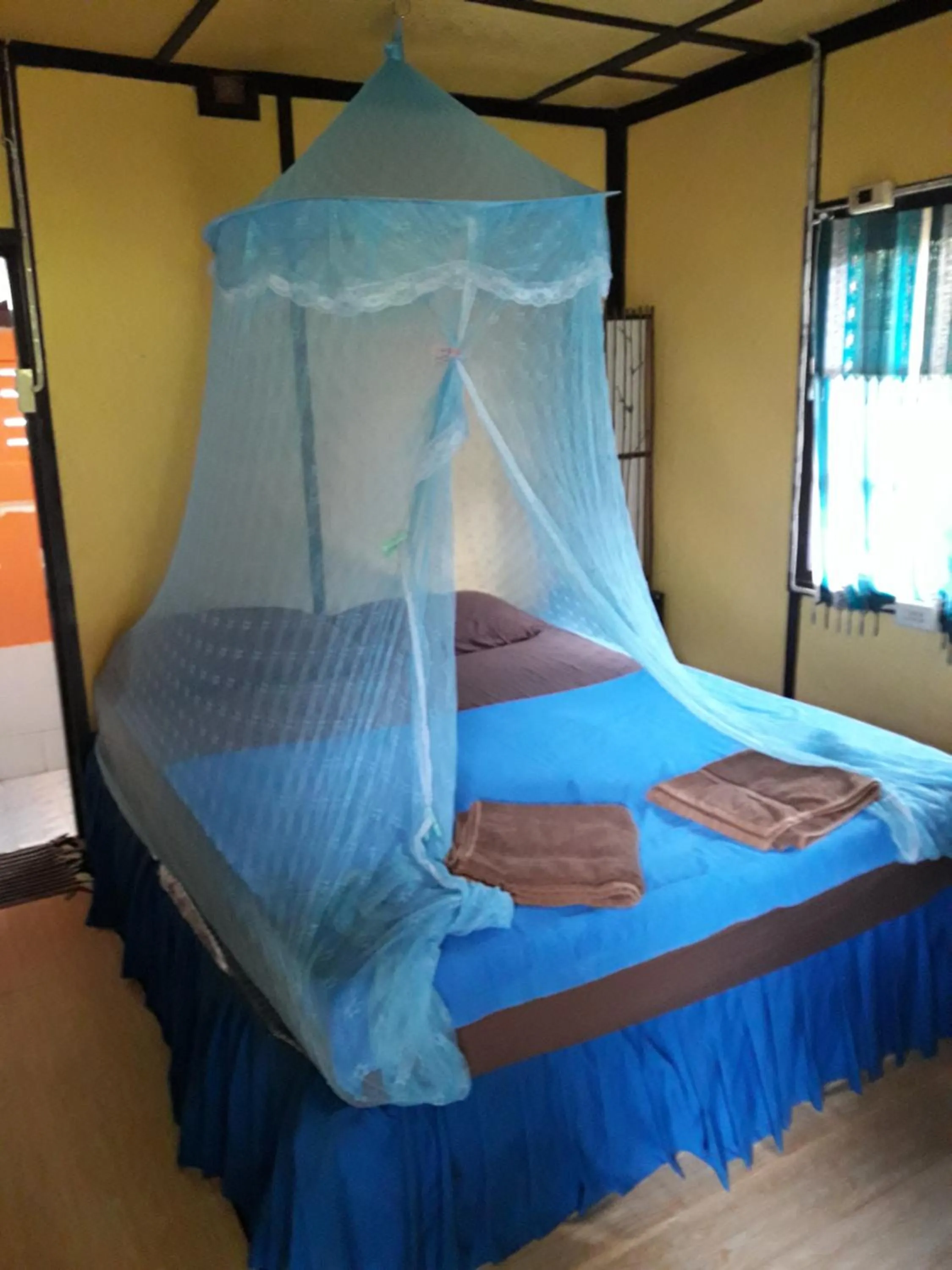 Bed in Jungle Hut Bungalows & Hotel