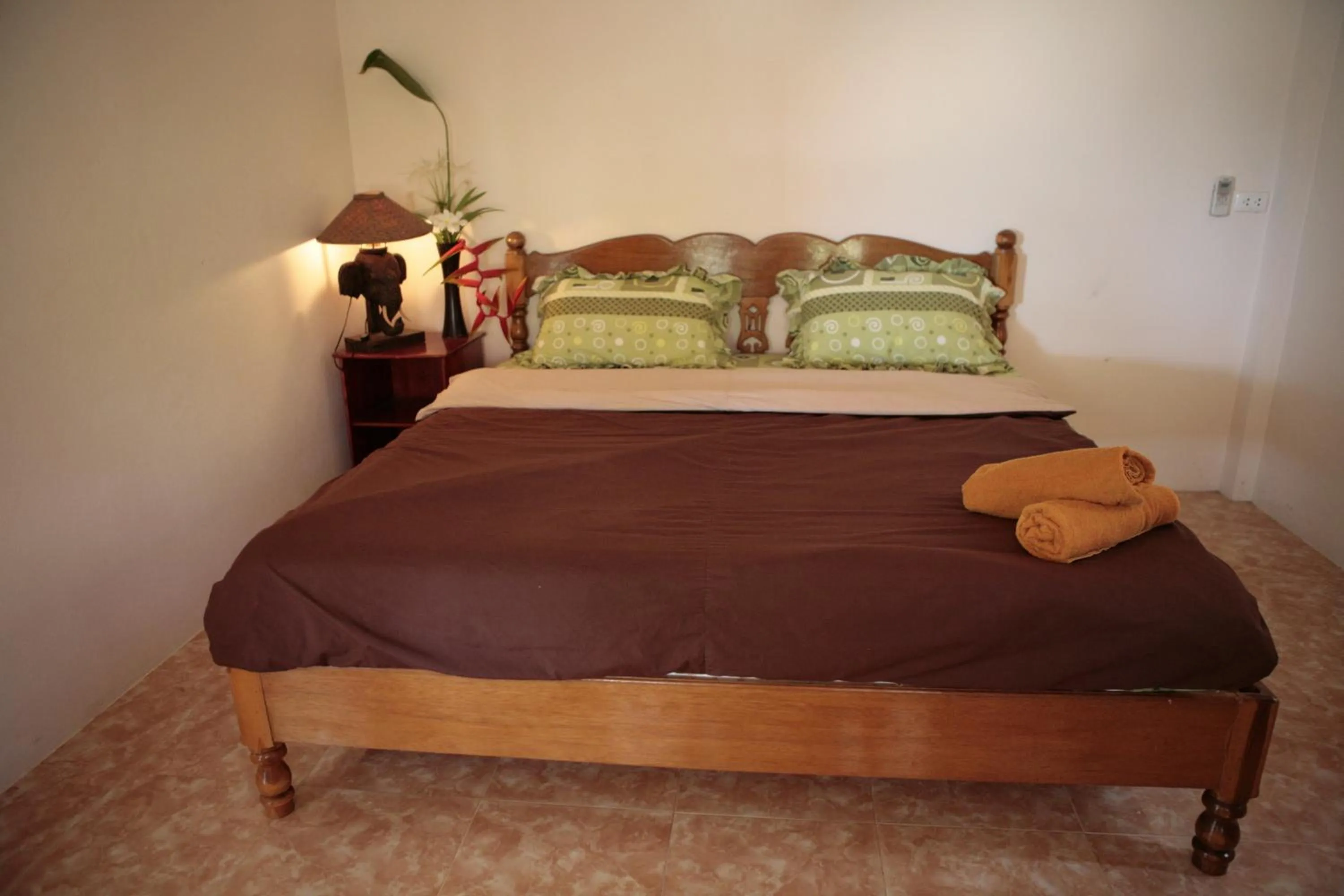 Bed in Jungle Hut Bungalows & Hotel