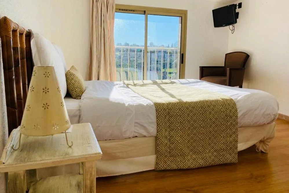 Bed in Avocado Hôtel Restaurant