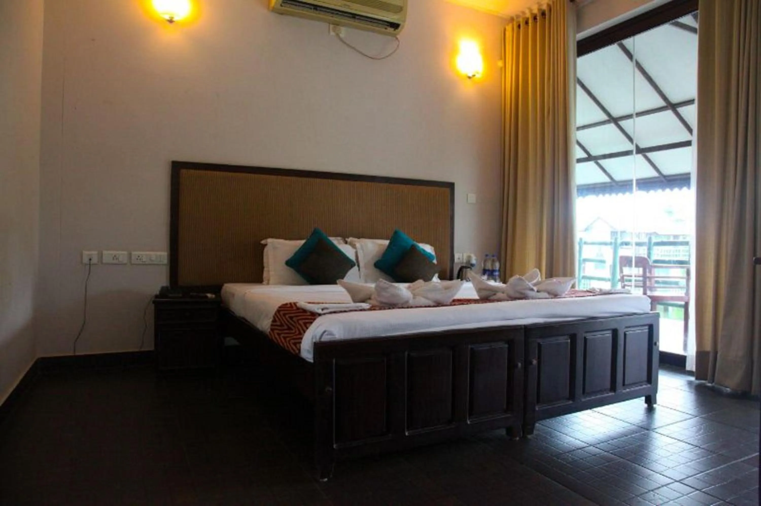 Bed in Kalathil Lake Resort