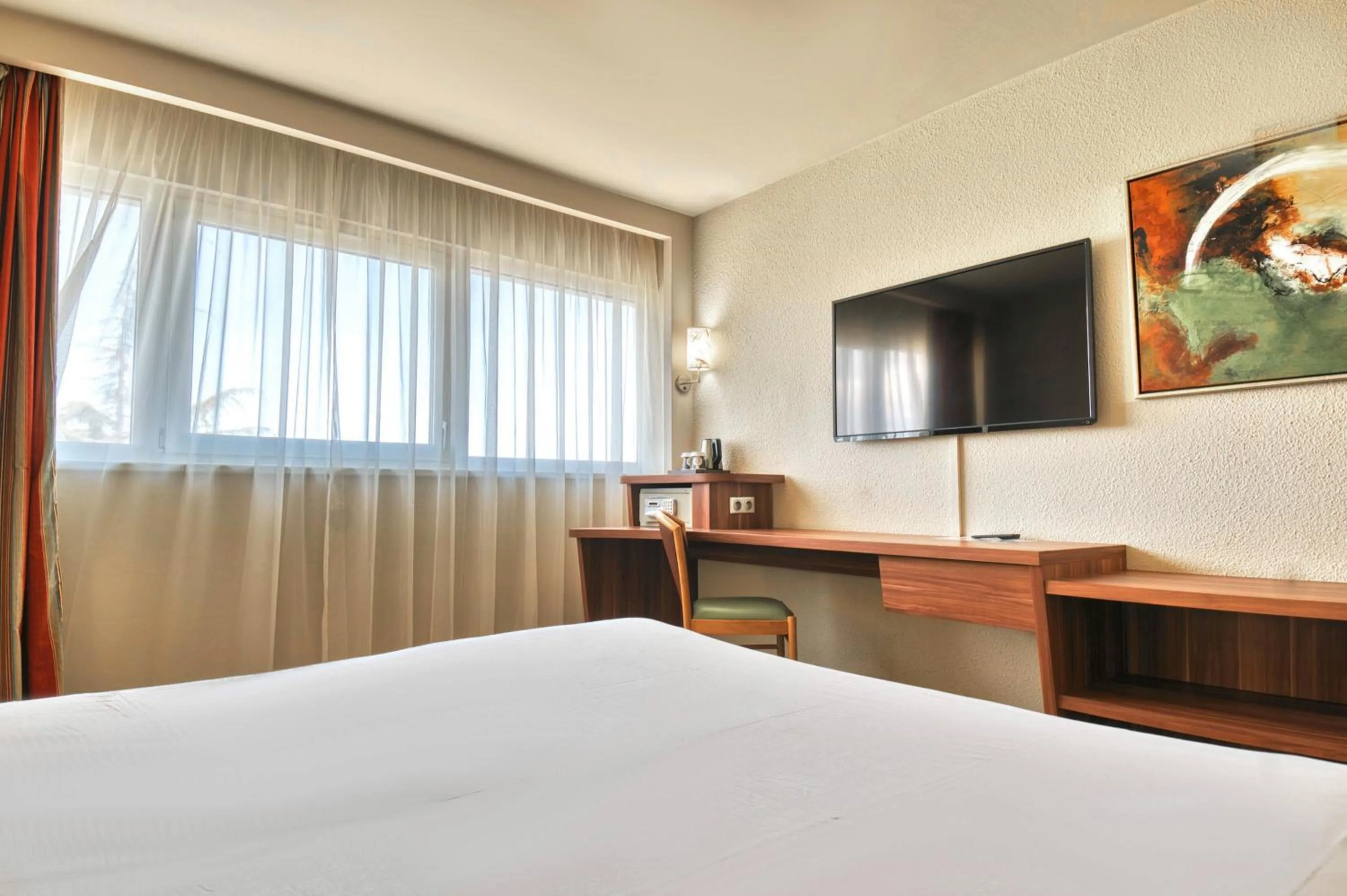 Bed in Kyriad Prestige Mulhouse - Basel