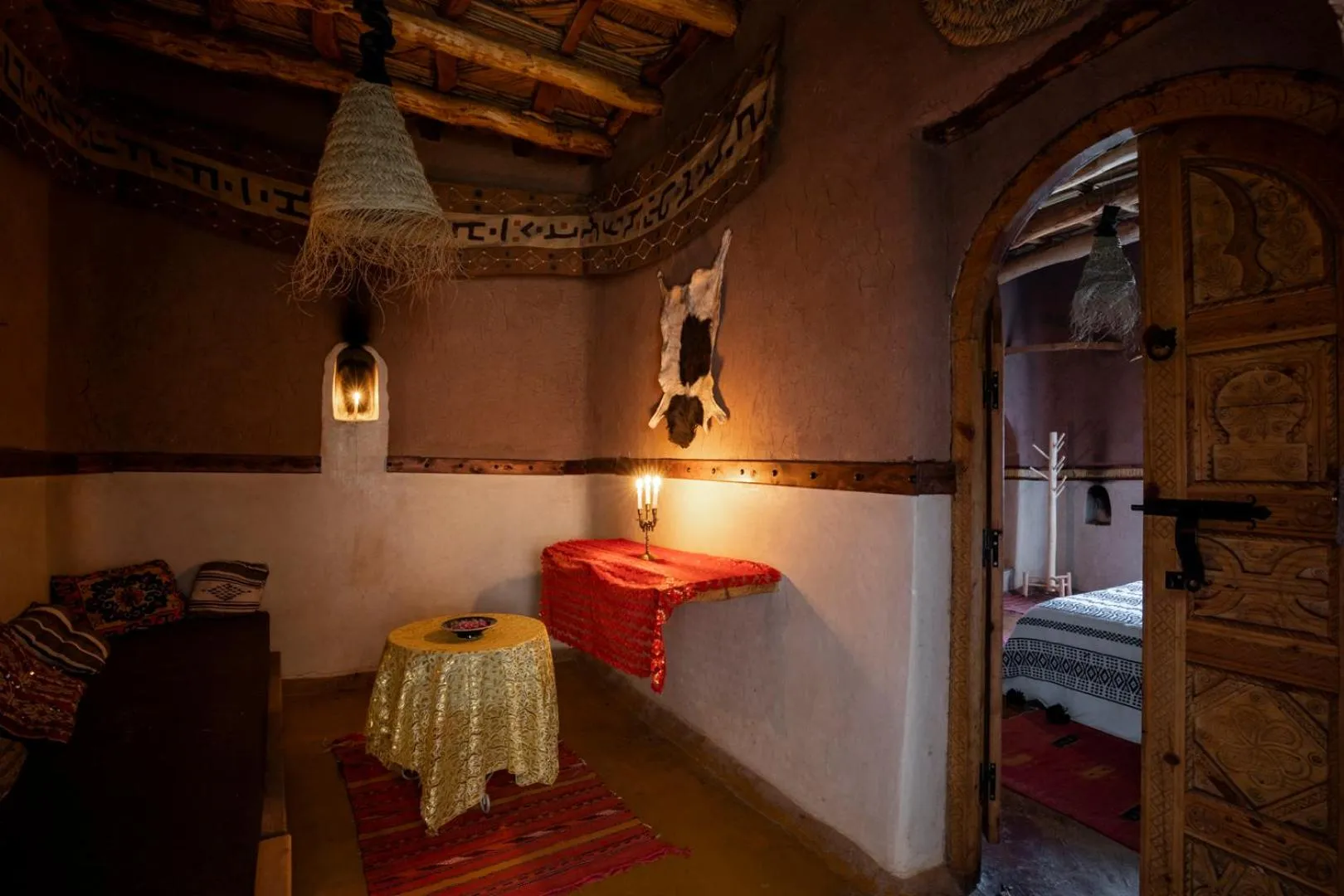 Seating area, Bed in Kasbah Tebi
