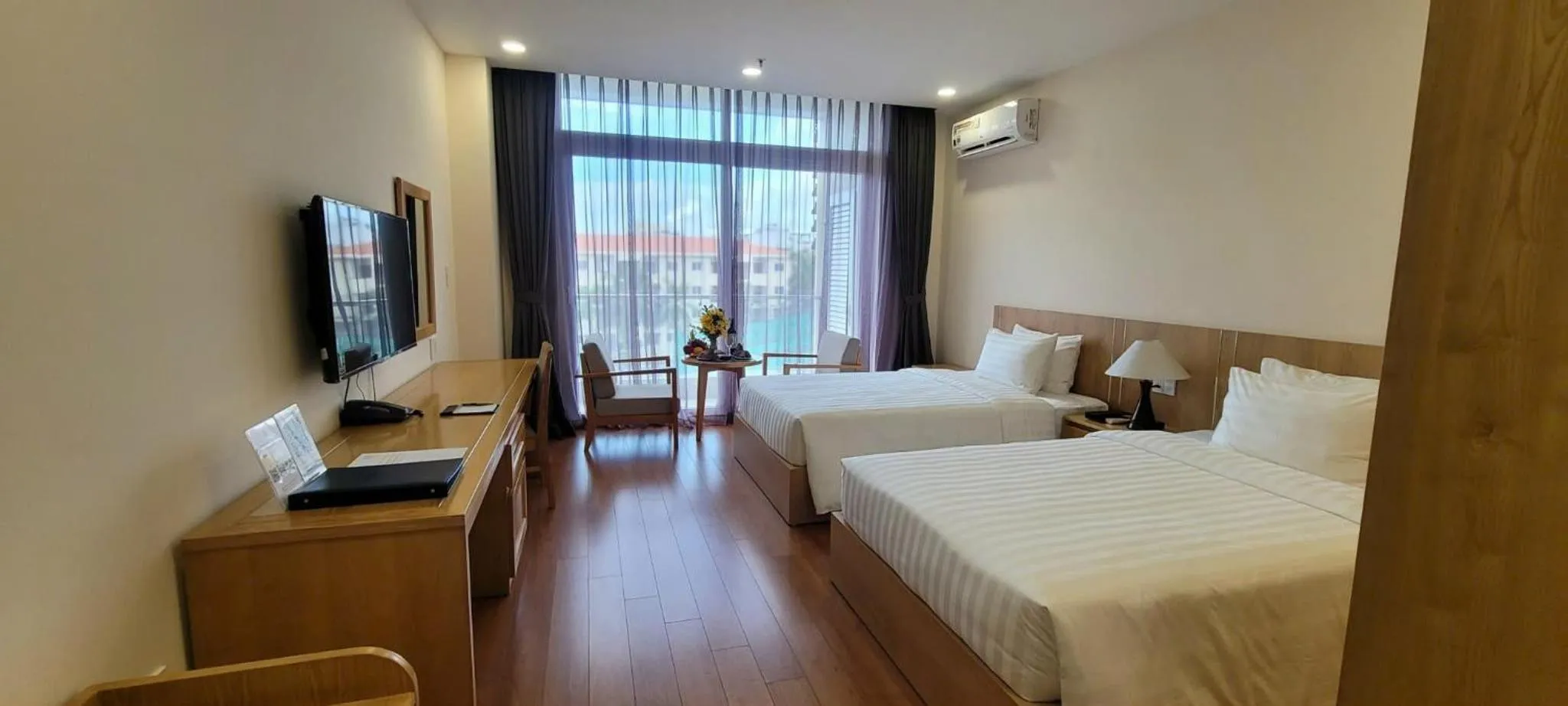 Bed in Sunflower Hotel & International Village