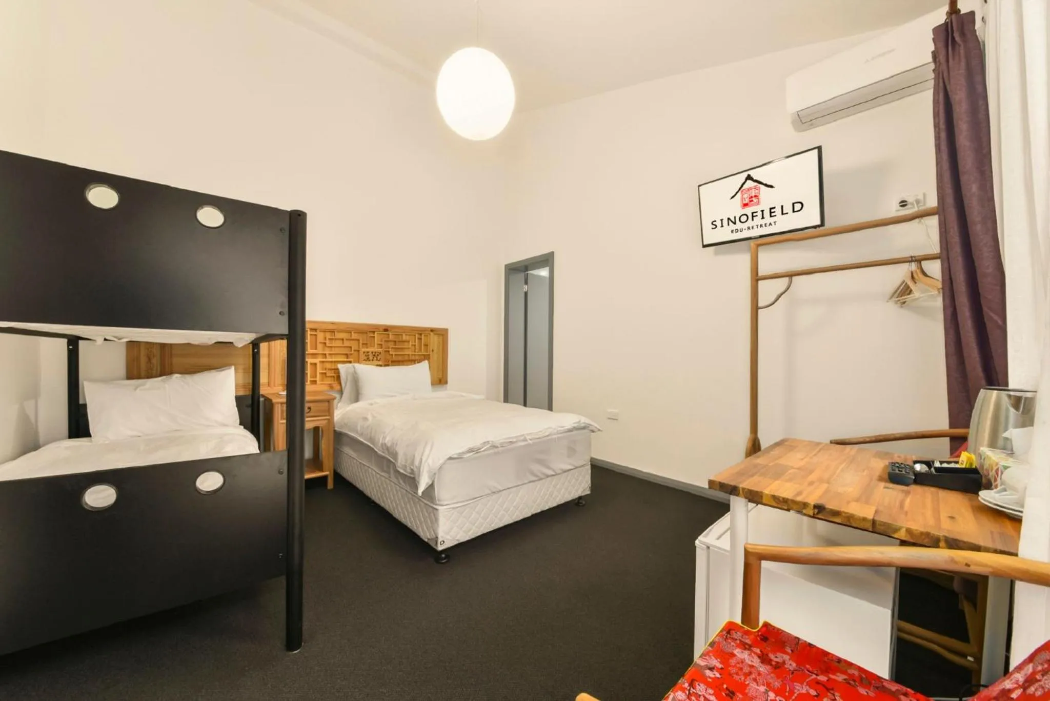 Bed in Sinofield Edu-Retreat