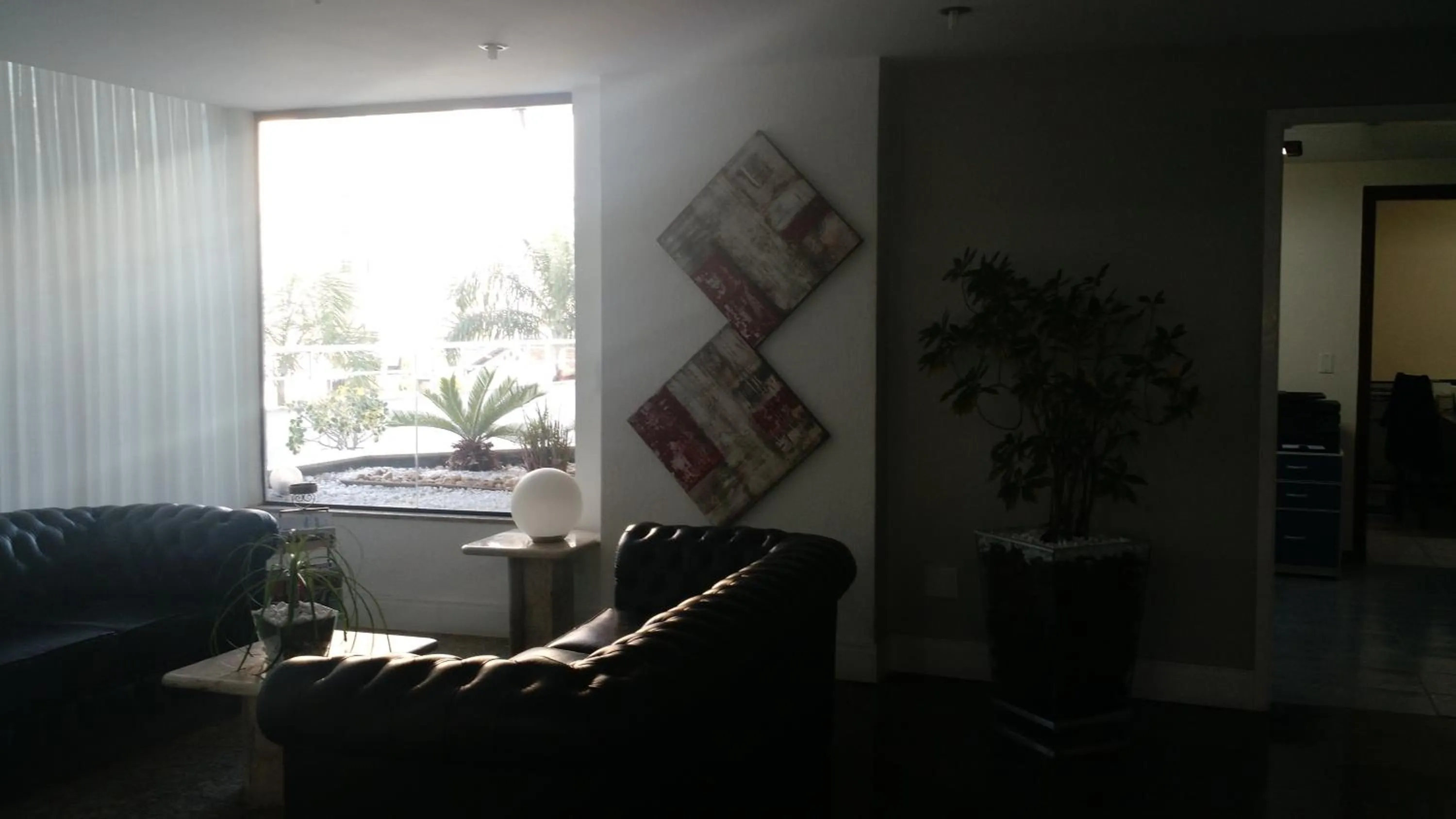 Communal lounge/ TV room in Plaza Suite Hotel