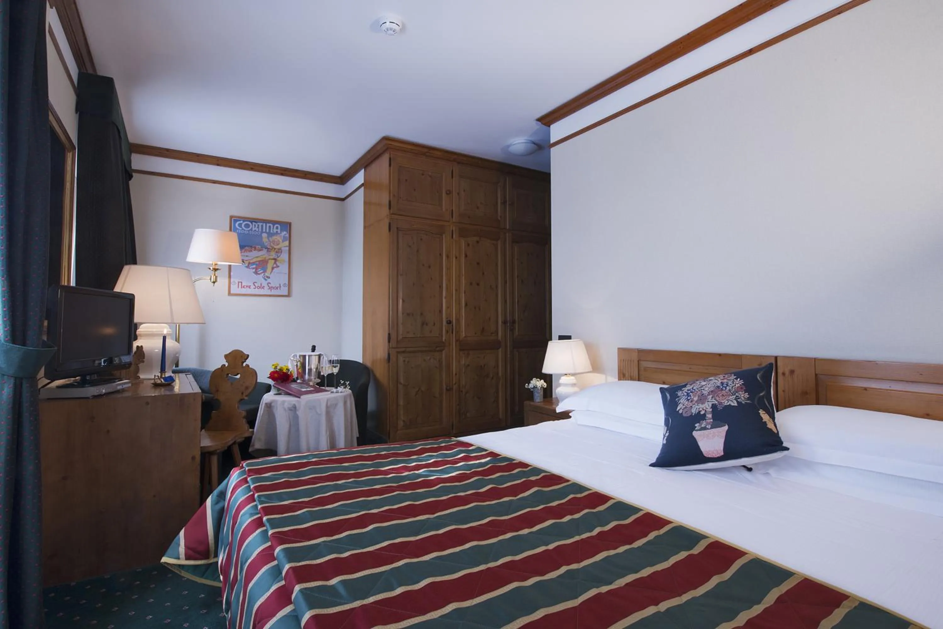 Photo of the whole room, Bed in Boutique Hotel Villa Blu Cortina D'Ampezzo