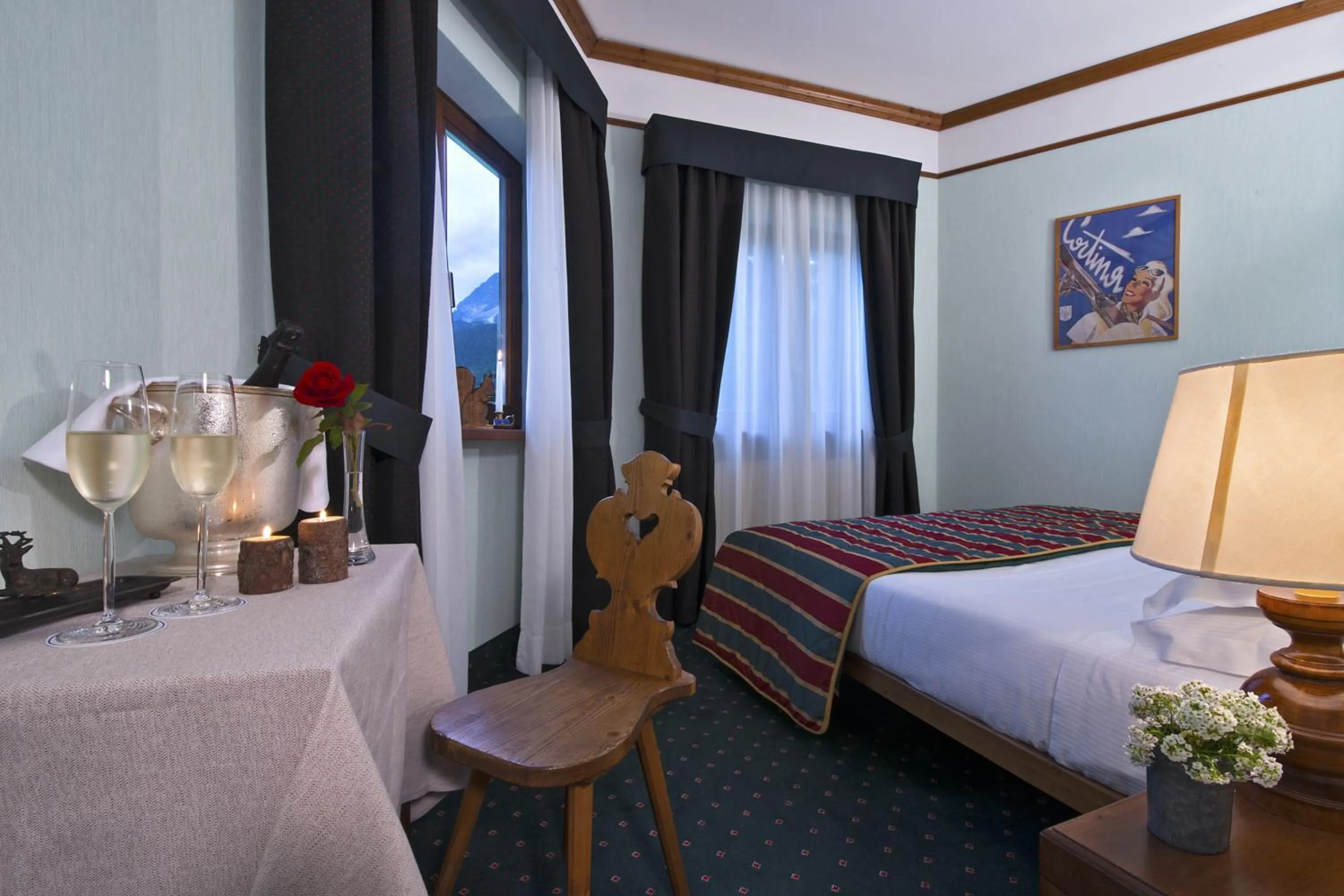 Photo of the whole room, Bed in Boutique Hotel Villa Blu Cortina D'Ampezzo