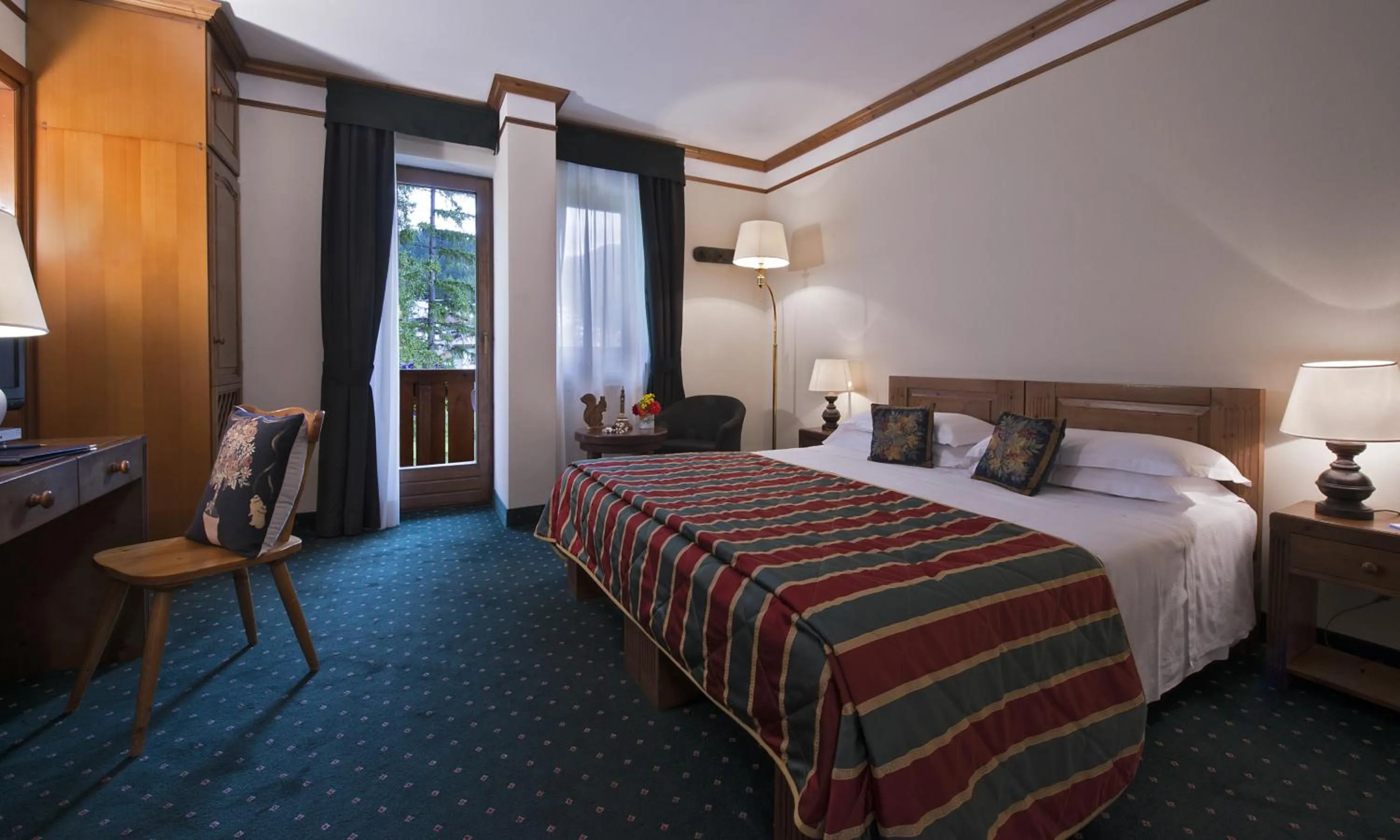 Photo of the whole room, Bed in Boutique Hotel Villa Blu Cortina D'Ampezzo