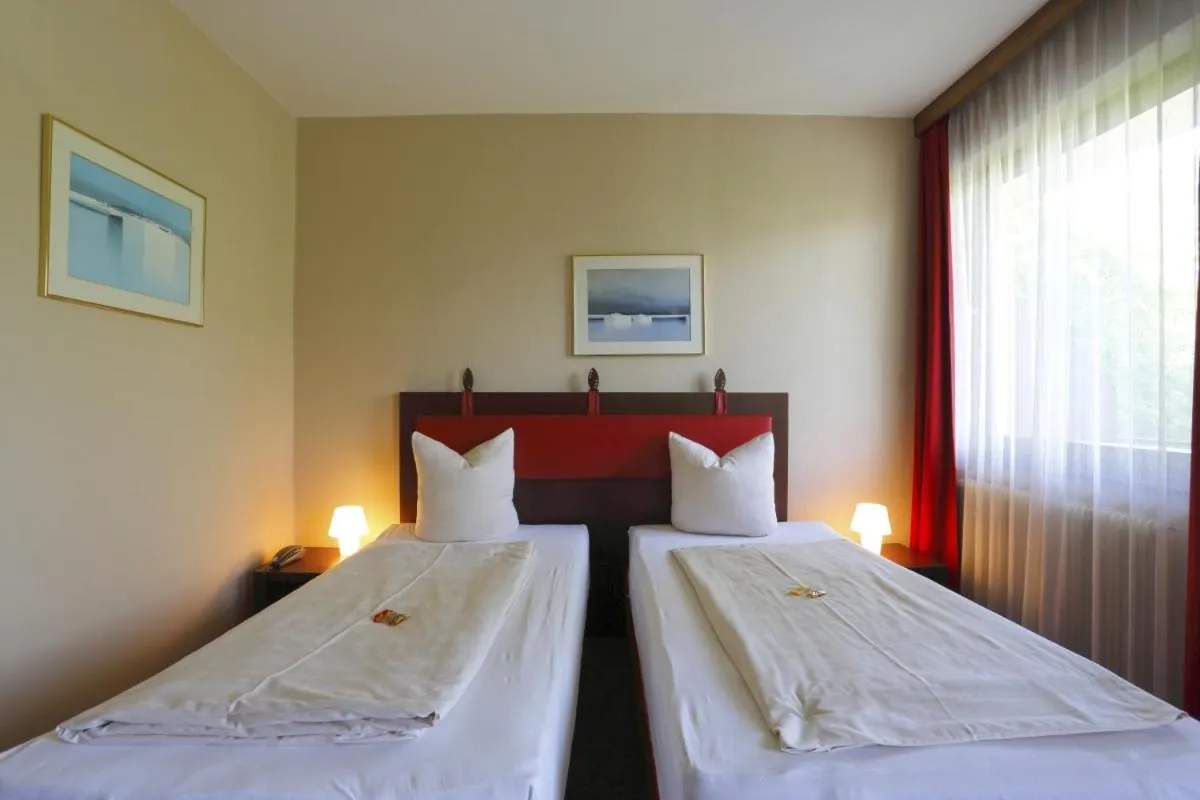 Bedroom, Bed in Alpen.Adria.Stadthotel