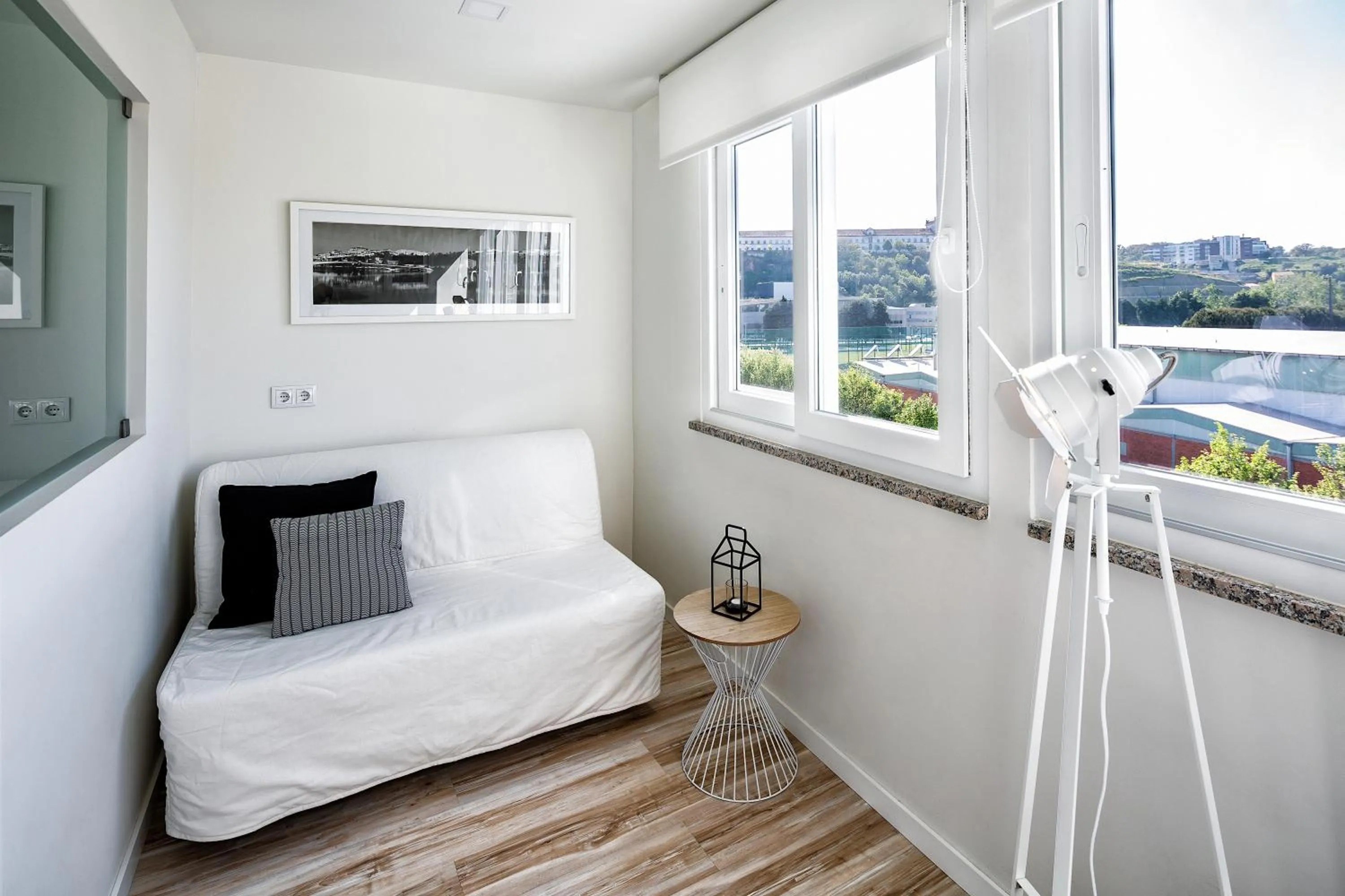 Seating area, Bed in JR Studios & Suites I Rius I