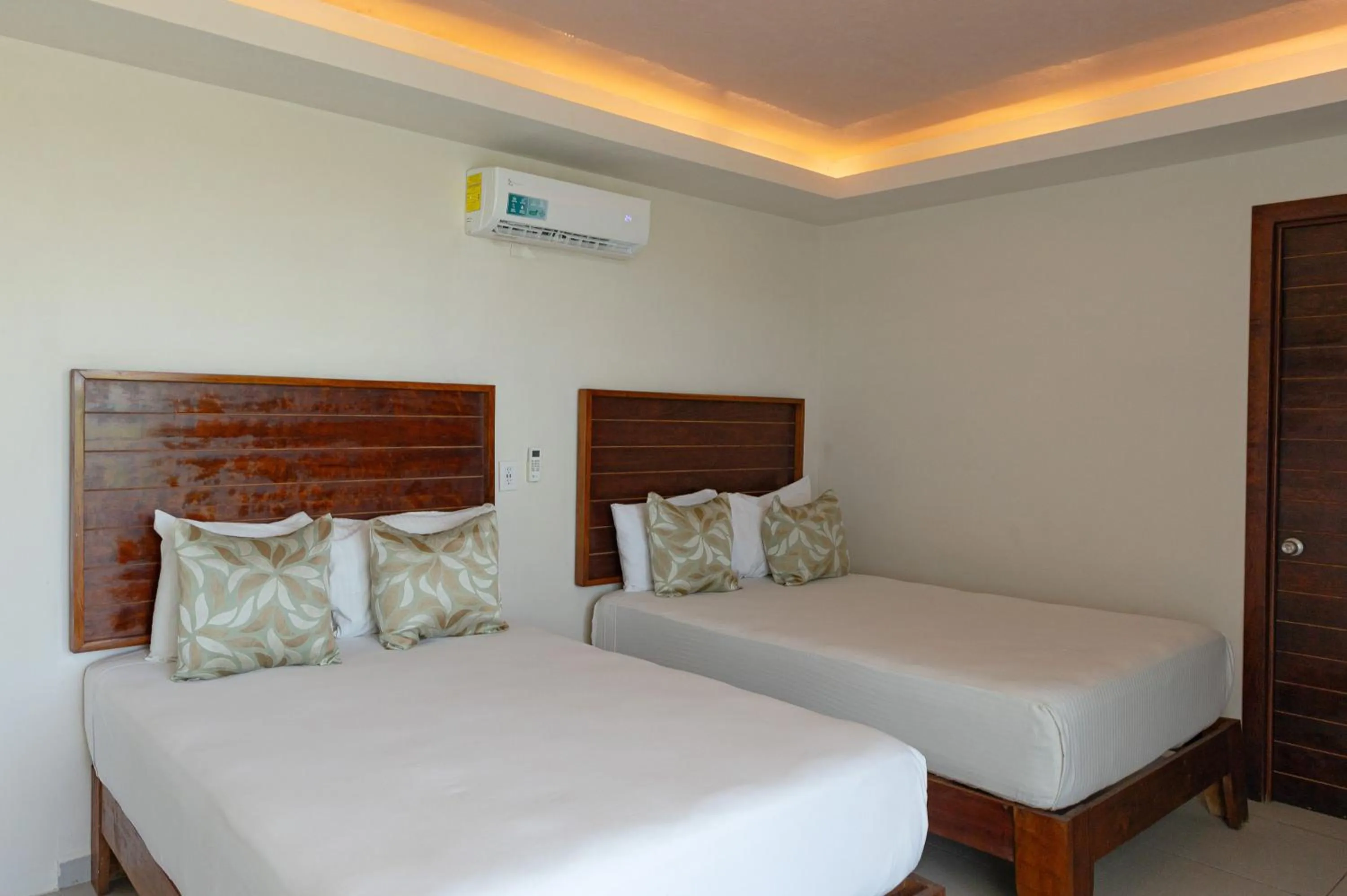 Bed in Aquastar Unique Hotel & Apartments Mahahual