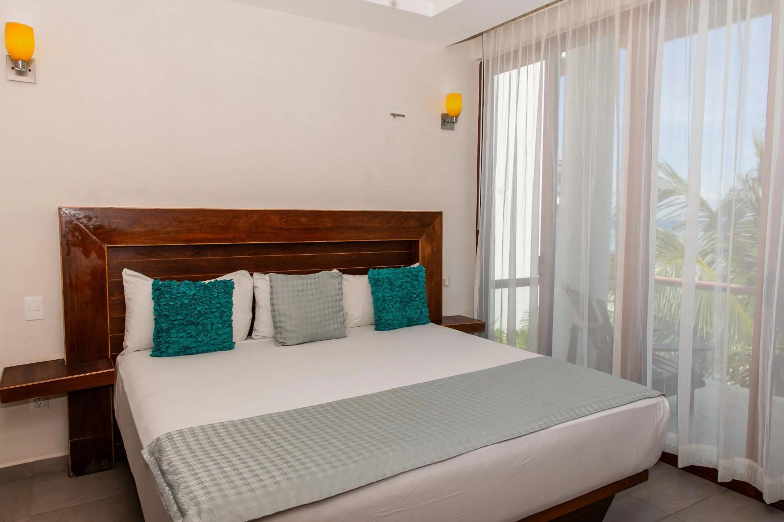 Bed in Aquastar Unique Hotel & Apartments Mahahual