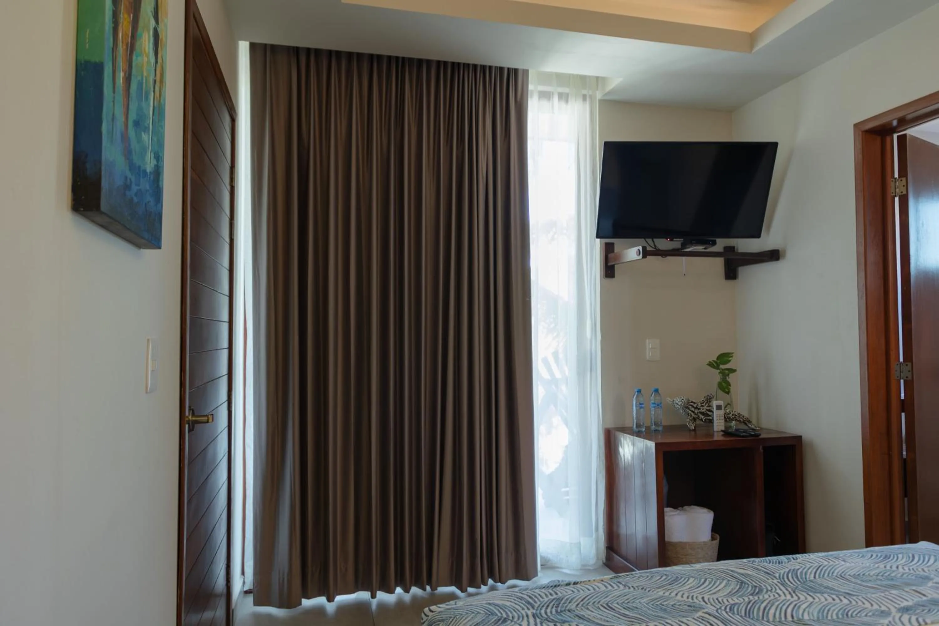 Seating area, Bed in Aquastar Unique Hotel & Apartments Mahahual