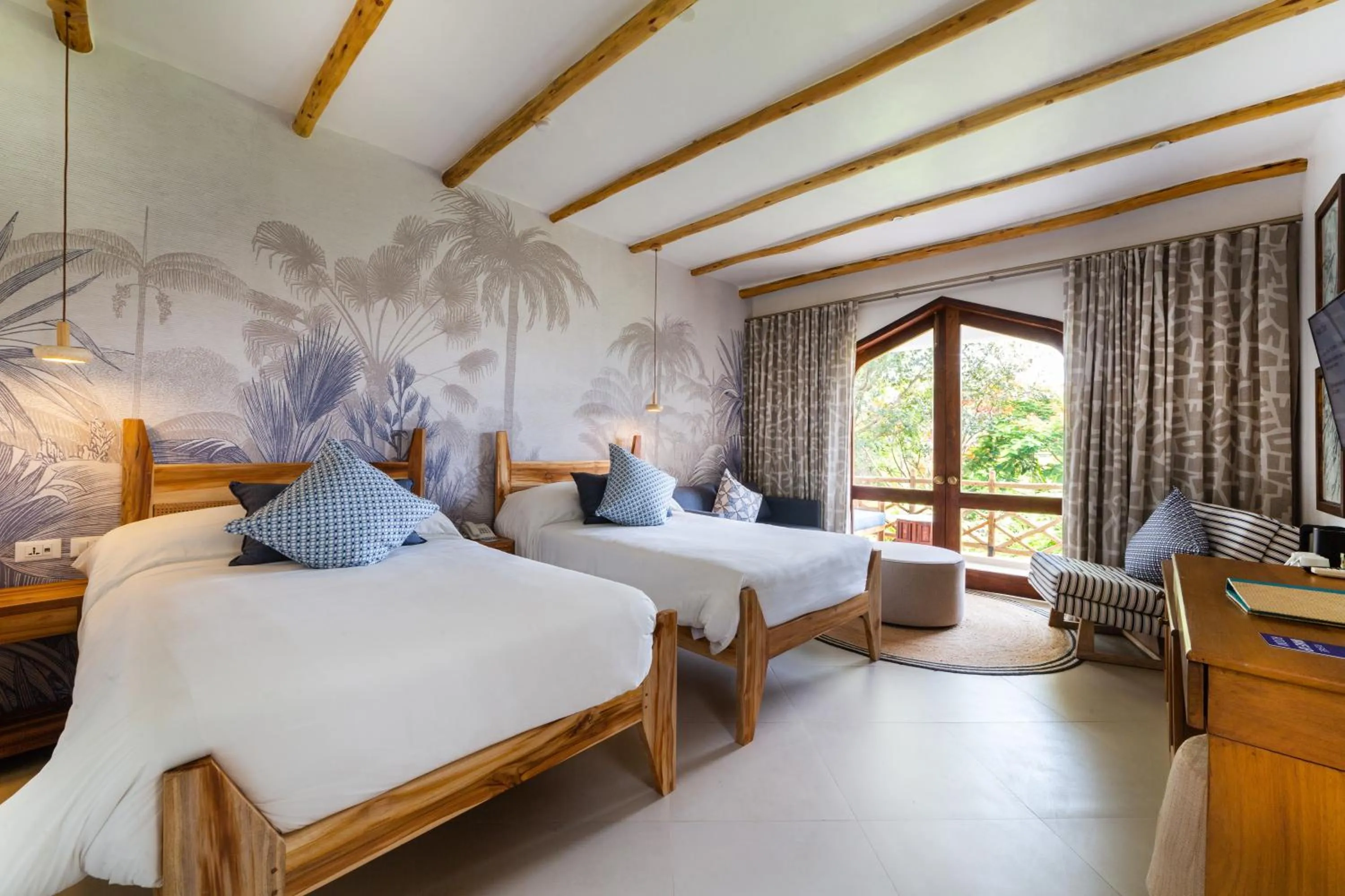Bed in Bluebay Beach Resort & Spa
