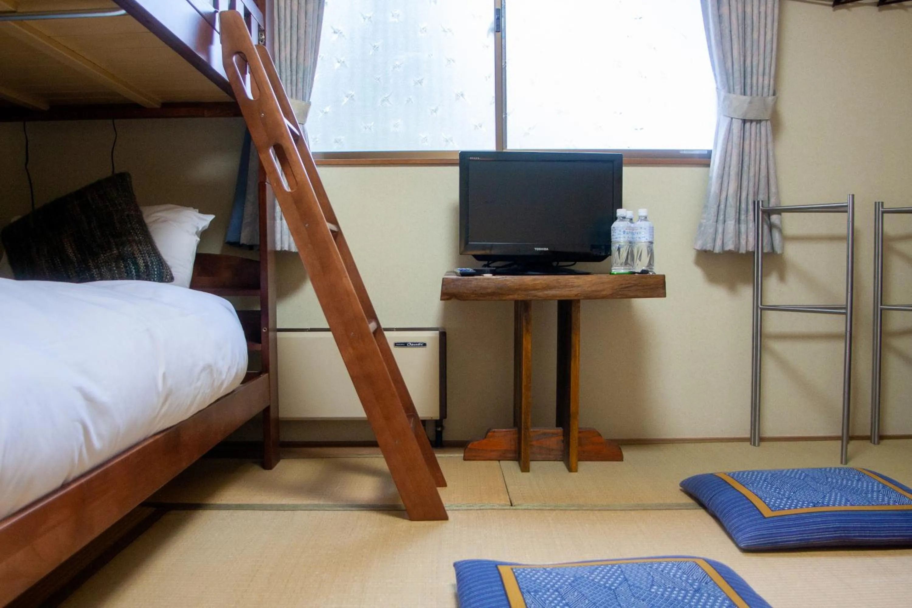 Bed in Kizuna Lodge & BBQ Centre