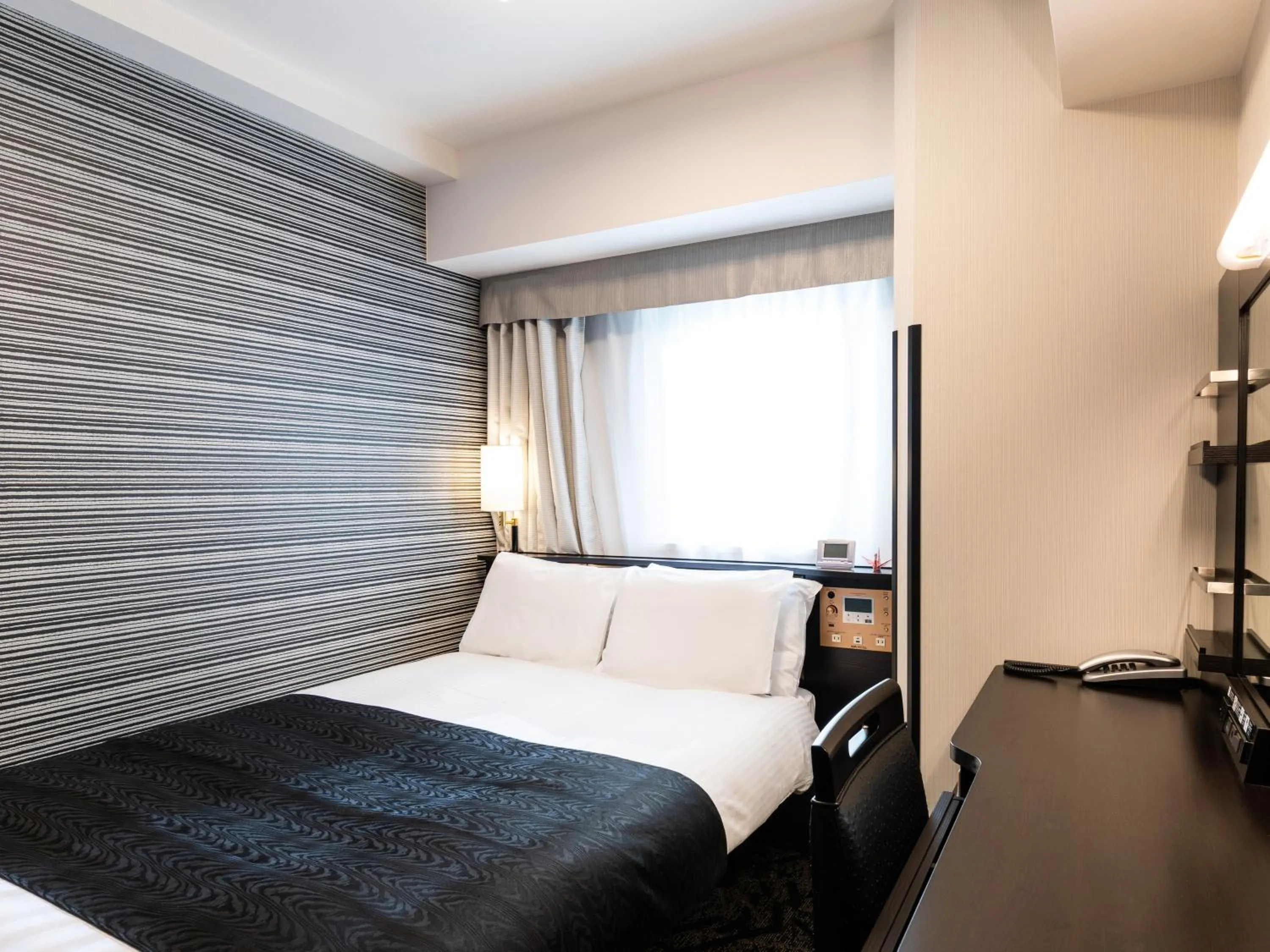 Photo of the whole room, Bed in APA Hotel Shibuya Dogenzakaue