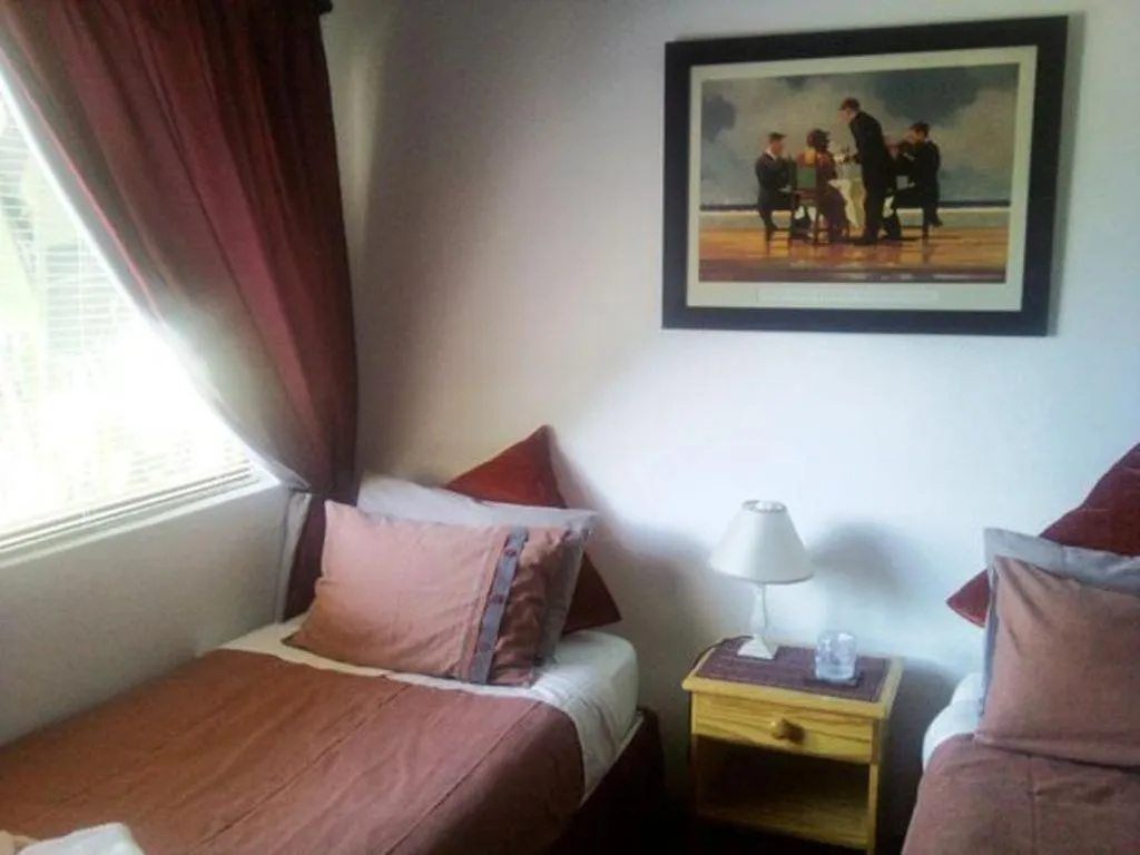 Bed in Magnolia Place Guest Houses