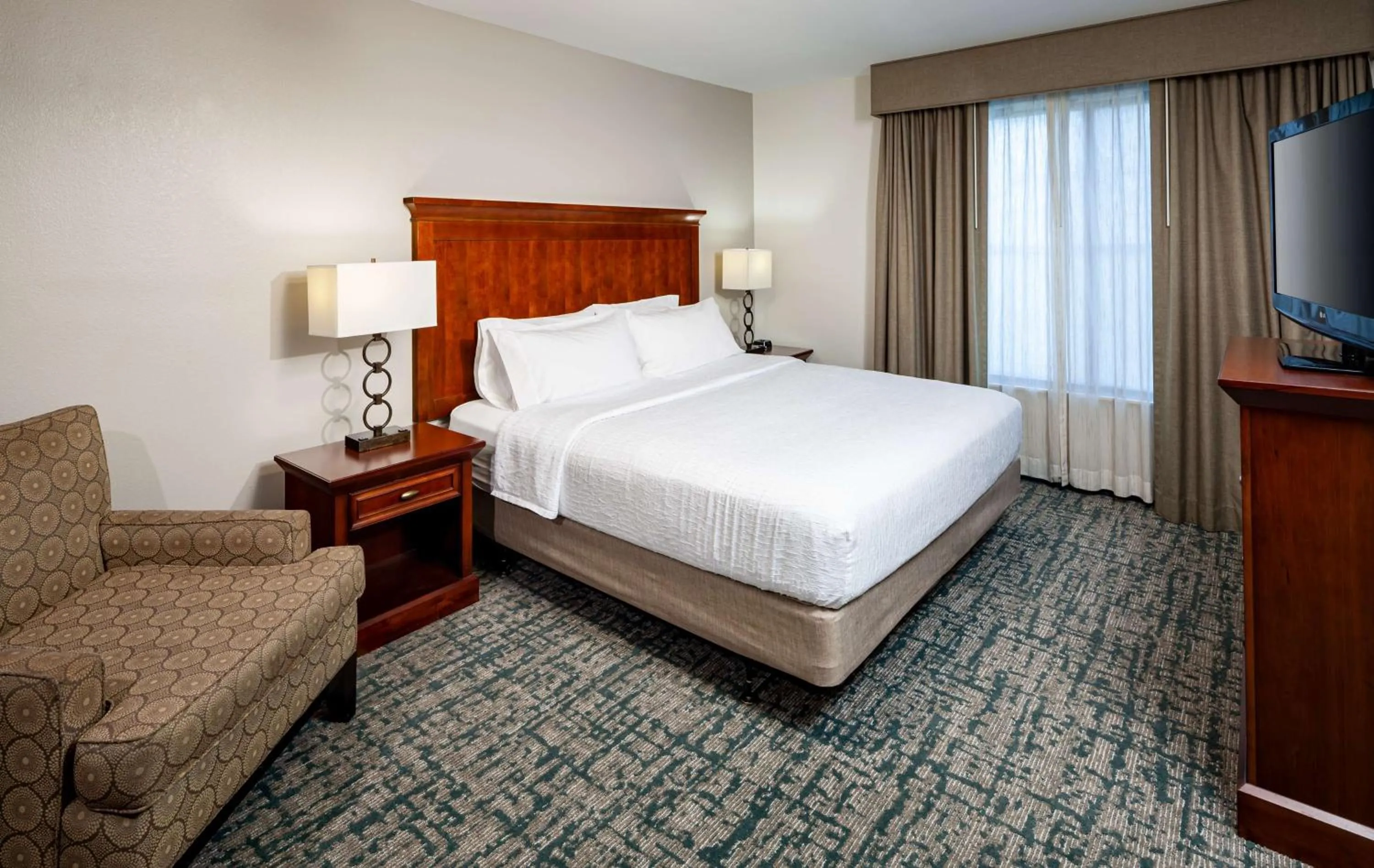 Bed in Homewood Suites by Hilton Gainesville