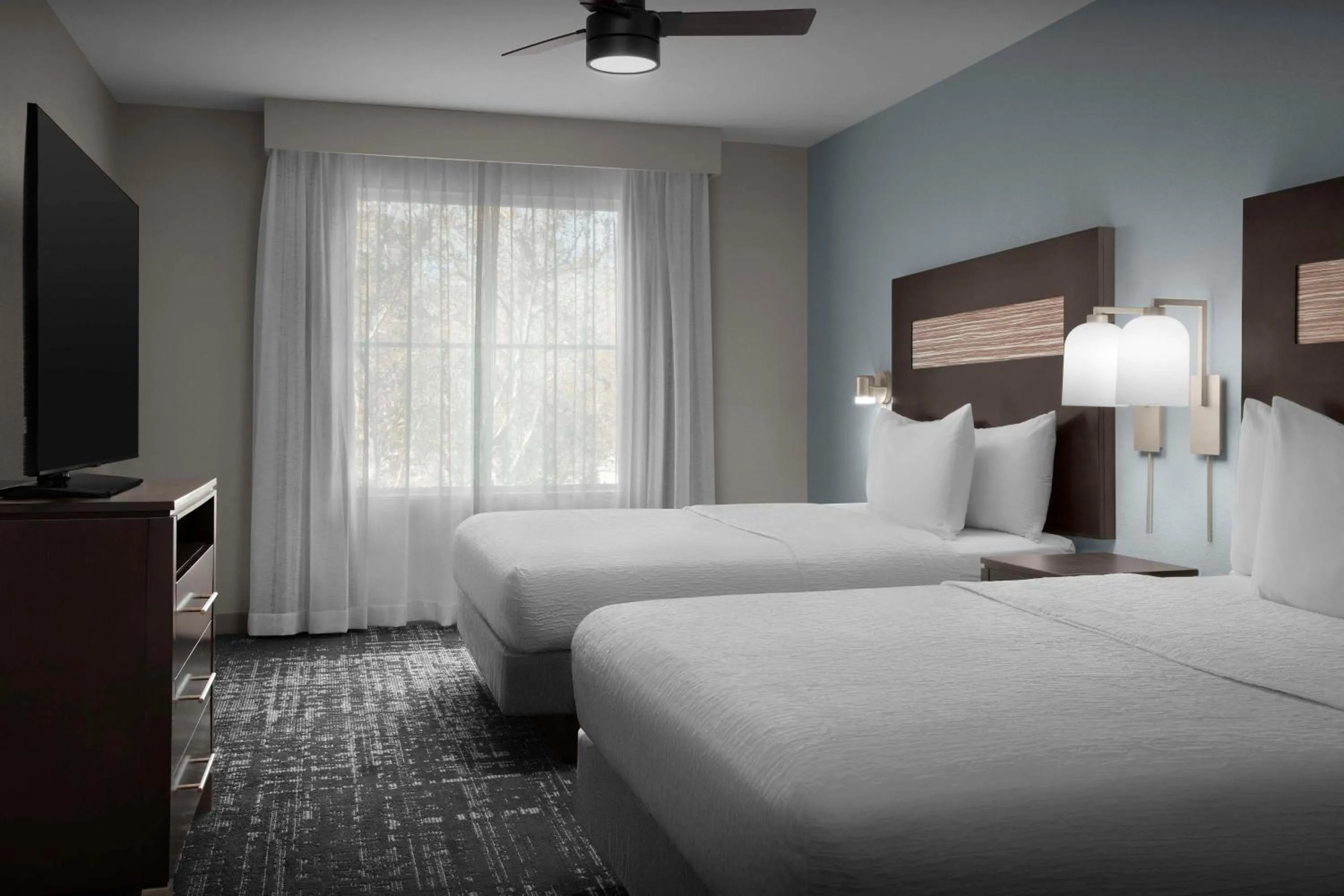 Bed in Homewood Suites by Hilton Orlando Airport