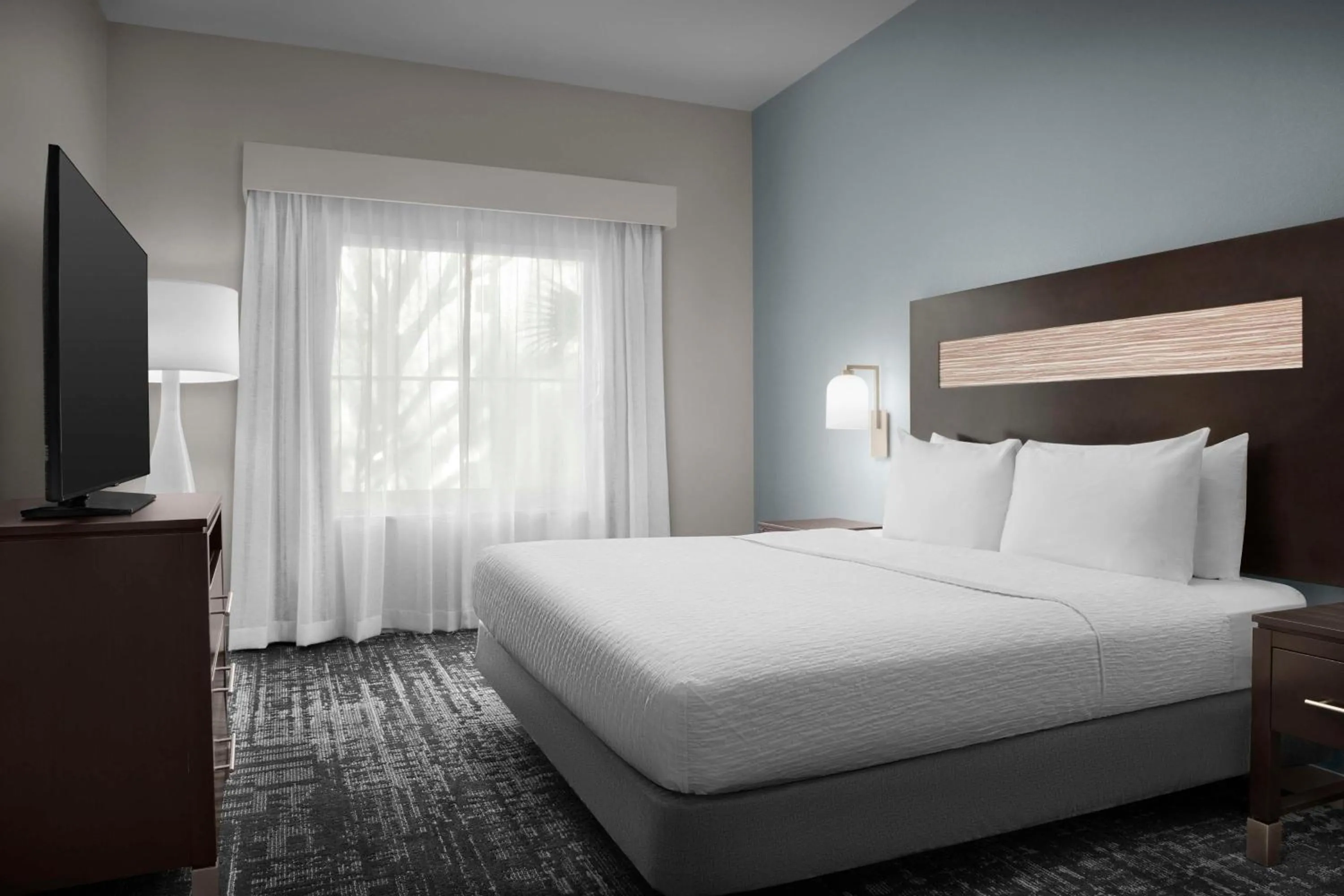 Bed in Homewood Suites by Hilton Orlando Airport