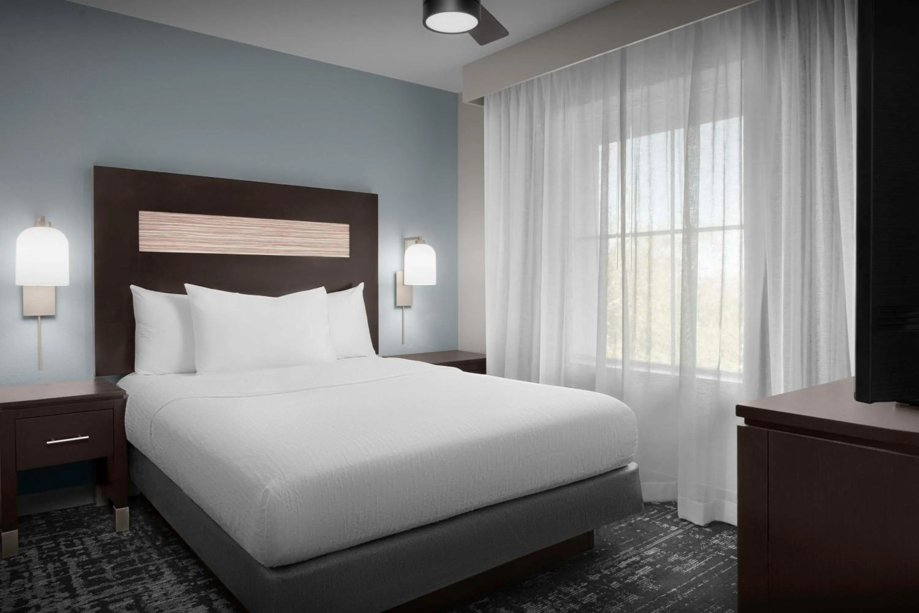 Bed in Homewood Suites by Hilton Orlando Airport