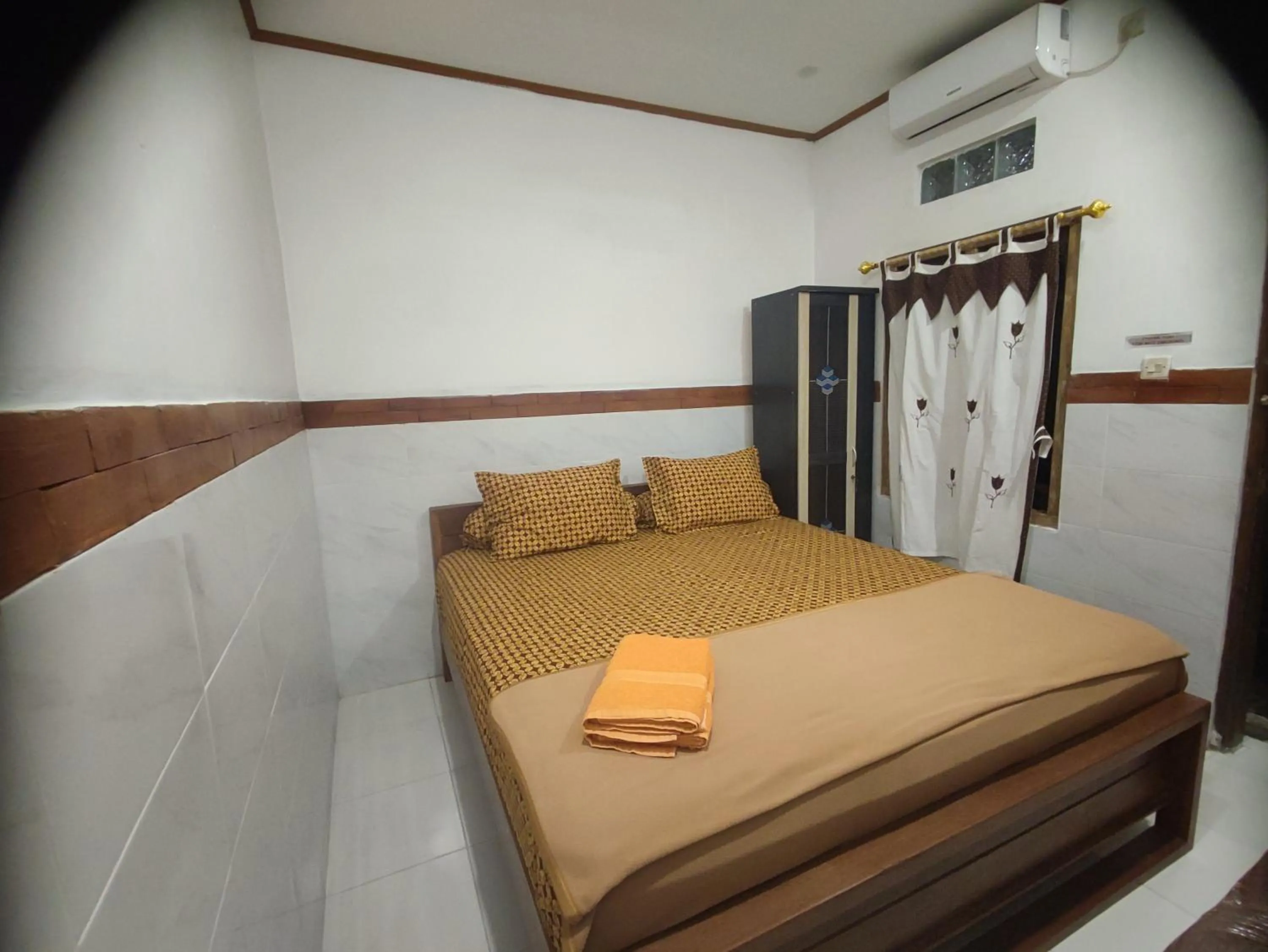 Bed in Genthong Homestay