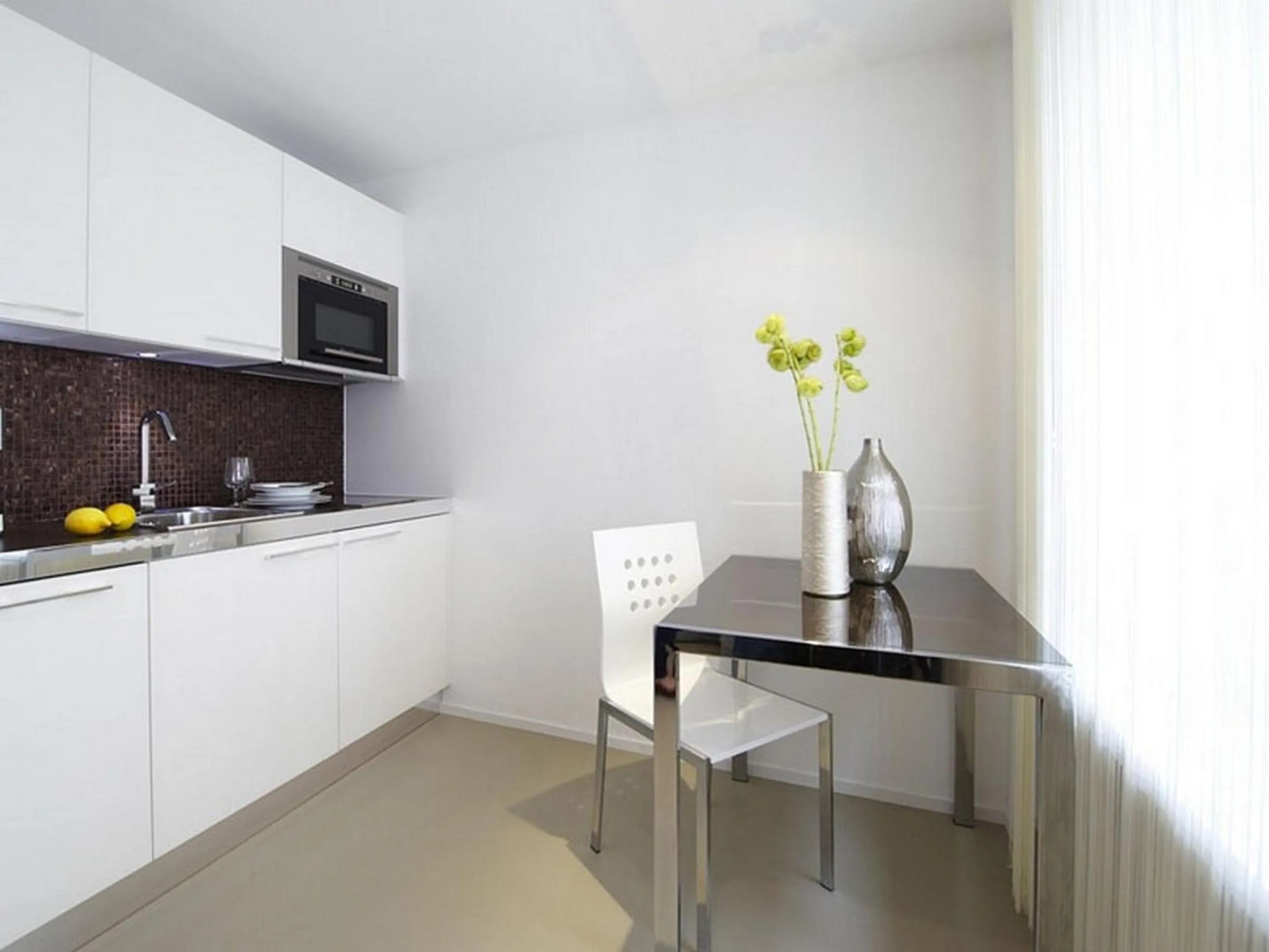 Kitchen or kitchenette in VISIONAPARTMENTS Zweierstrasse - contactless check-in